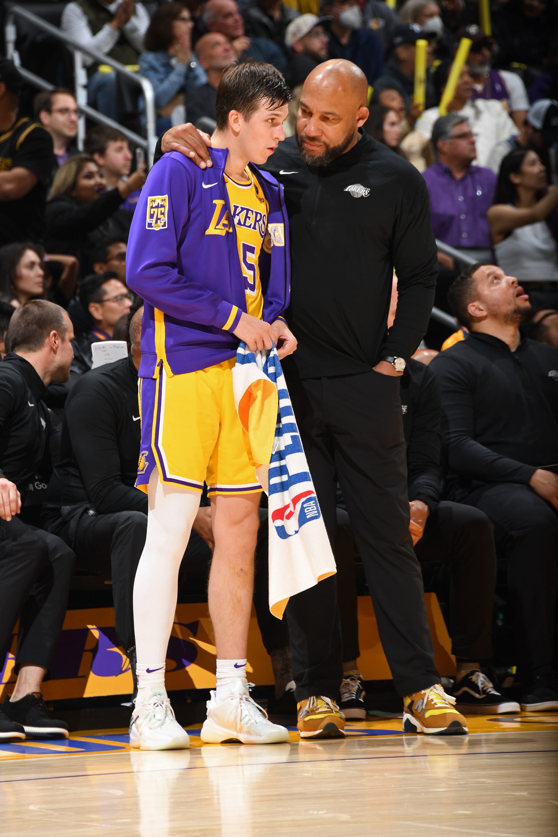 LOS ANGELES, CA - APRIL 28: Head Coach Darvin Ham speaks with Austin Reaves #15 of the Los Angeles Lakers during Round 1 Game 6 of the 2023 NBA Playoffs against the Memphis Grizzlies on April 28, 2023 at Crypto.Com Arena in Los Angeles, California. NOTE TO USER: User expressly acknowledges and agrees that, by downloading and/or using this Photograph, user is consenting to the terms and conditions of the Getty Images License Agreement. Mandatory Copyright Notice: Copyright 2023 NBAE (Photo by Andrew D. Bernstein/NBAE via Getty Images)