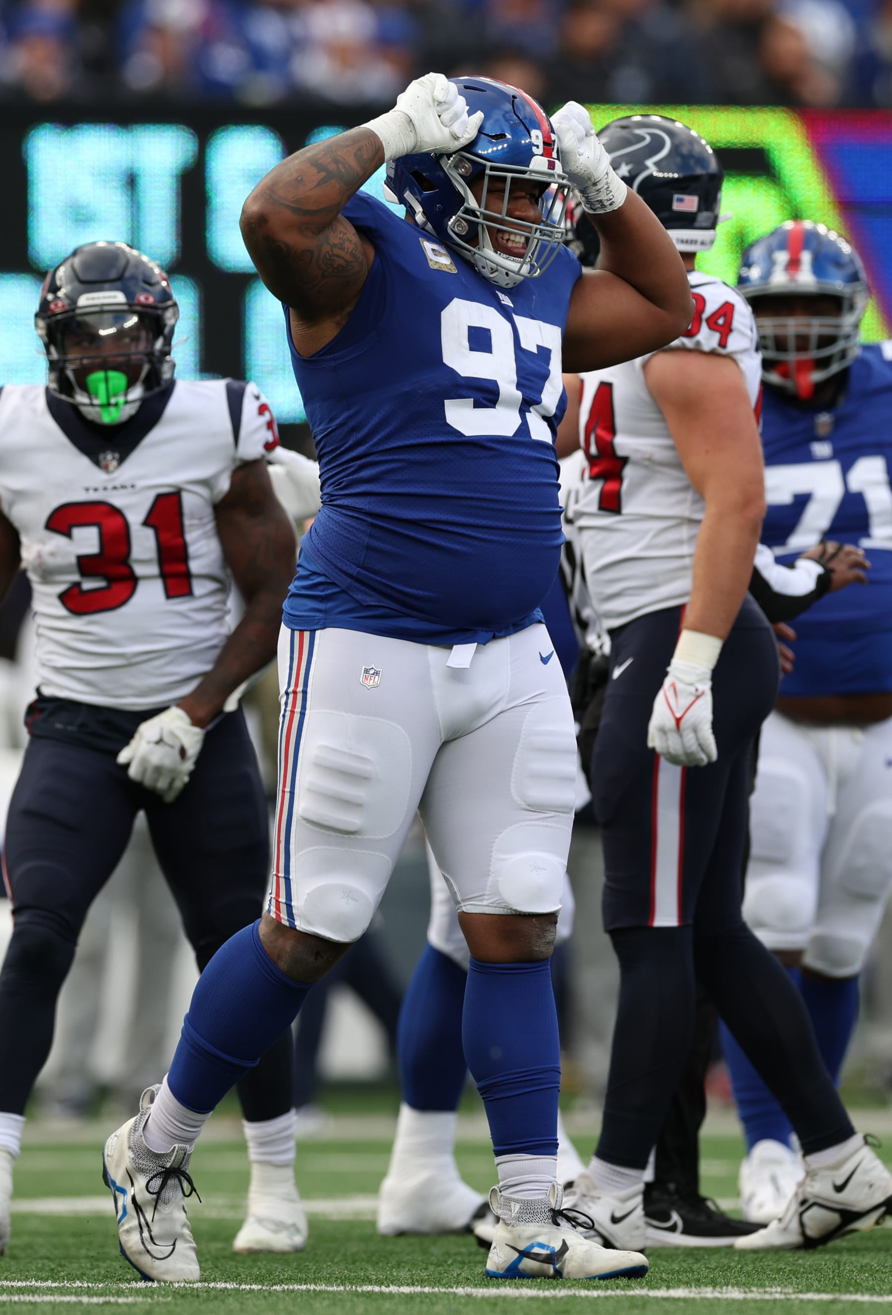 EAST RUTHERFORD, NEW JERSEY - NOVEMBER 13: Dexter Lawrence #97 of the New York Giants reacts after a play during the first half in the game aht at MetLife Stadium on November 13, 2022 in East Rutherford, New Jersey. (Photo by Jamie Squire/Getty Images)