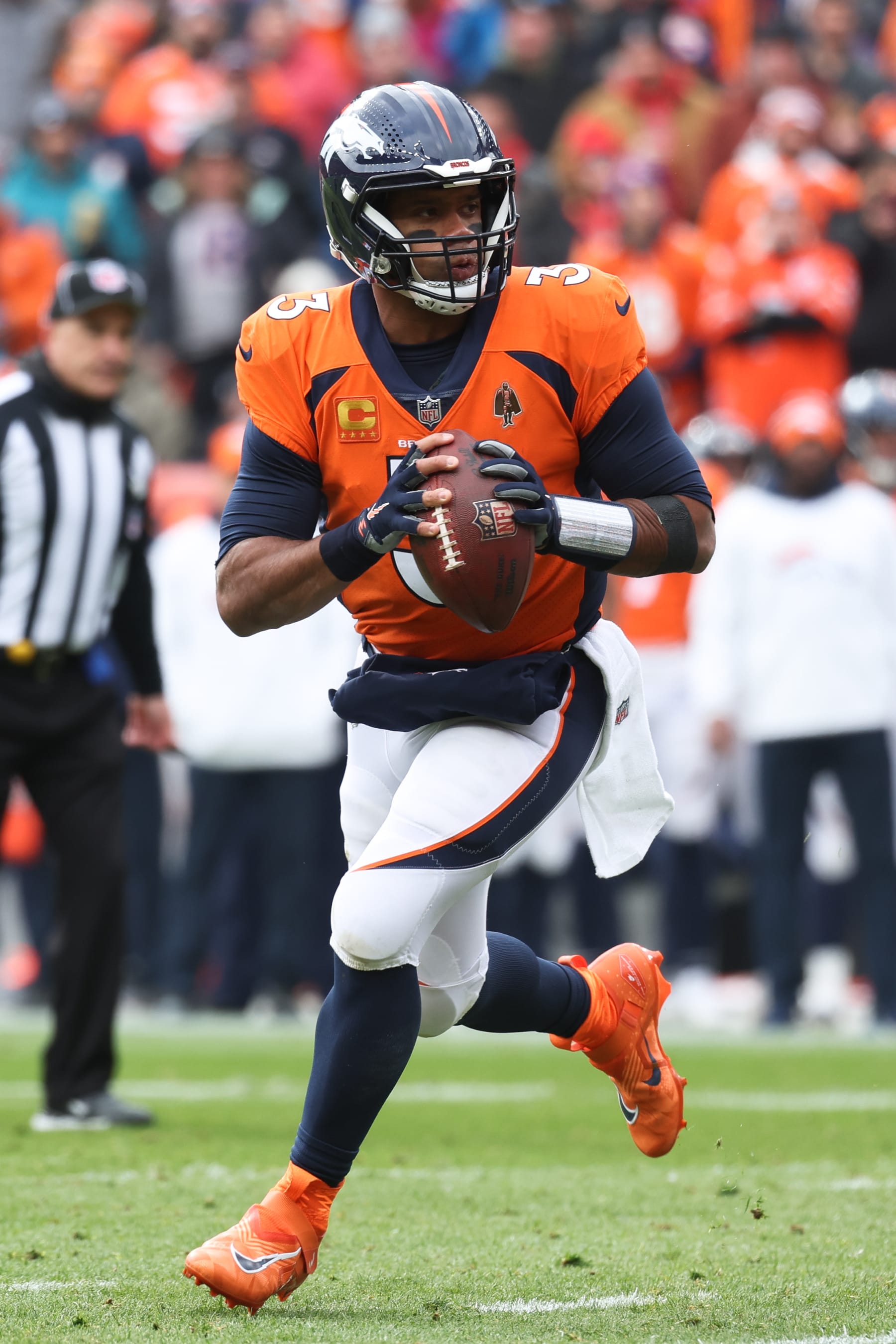 DENVER, COLORADO - OCTOBER 29: Russell Wilson #3 of the Denver Broncos runs with the ball against the Kansas City Chiefs at Empower Field At Mile High on October 29, 2023 in Denver, Colorado. (Photo by Justin Tafoya/Getty Images)