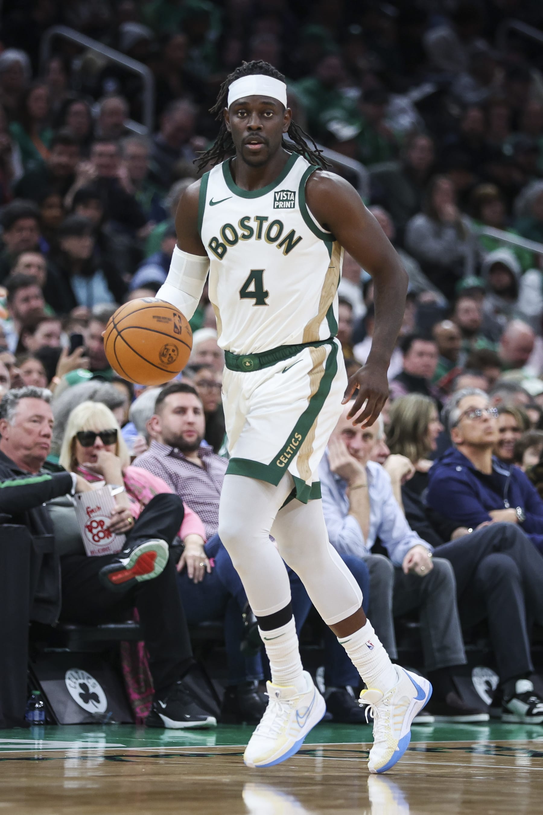 BOSTON, MA - FEBRUARY 27:  Jrue Holiday #4 of the Boston Celtics dribbles during a game against the Philadelphia 76ers at TD Garden on February 27, 2024 in Boston, Massachusetts. NOTE TO USER: User expressly acknowledges and agrees that, by downloading and or using this photograph, User is consenting to the terms and conditions of the Getty Images License Agreement. (Photo by Adam Glanzman/Getty Images)