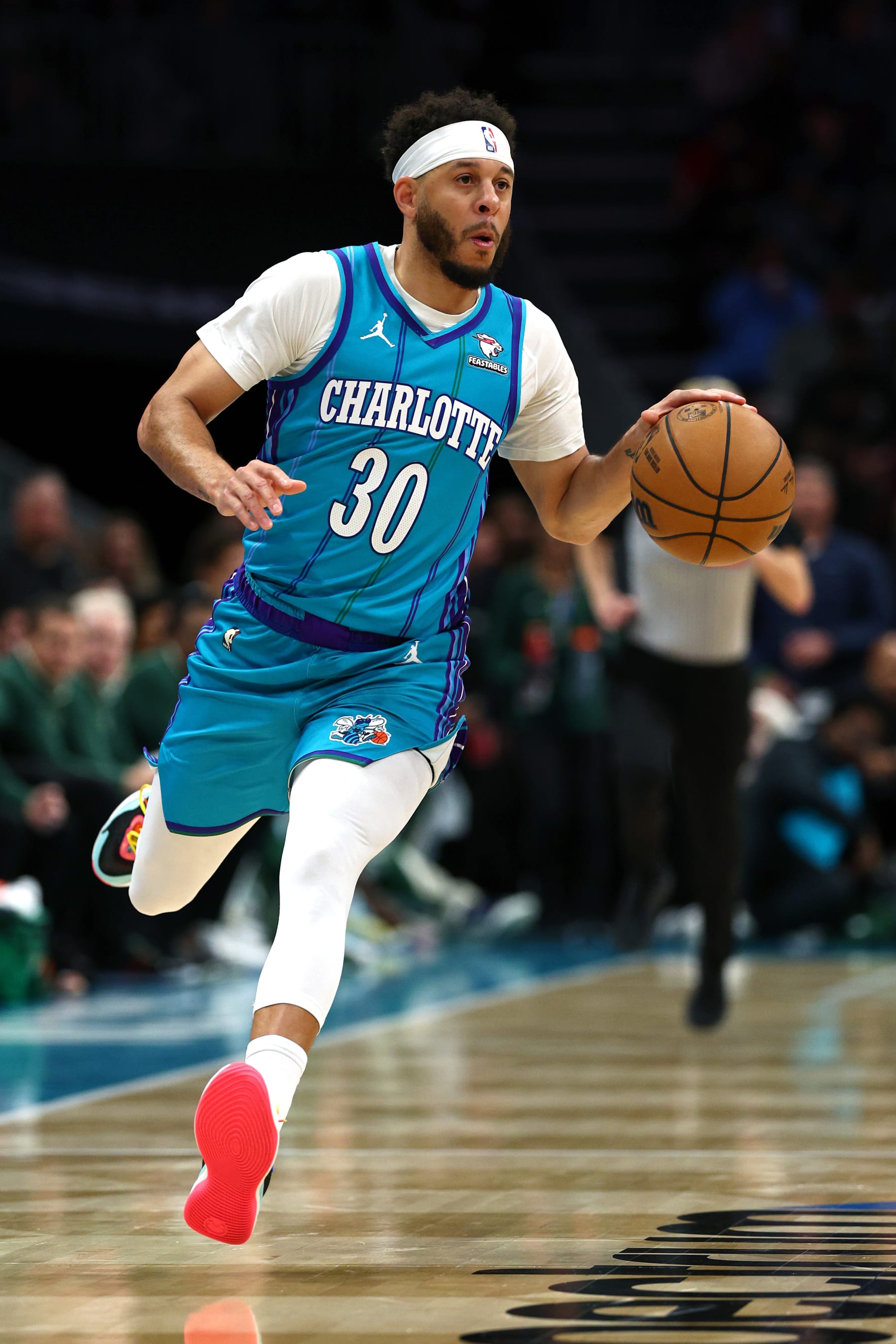 CHARLOTTE, NORTH CAROLINA - FEBRUARY 29: Seth Curry #30 of the Charlotte Hornets dribbles during the first half of the game against the Milwaukee Bucks at Spectrum Center on February 29, 2024 in Charlotte, North Carolina. NOTE TO USER: User expressly acknowledges and agrees that, by downloading and or using this photograph, User is consenting to the terms and conditions of the Getty Images License Agreement. (Photo by Jared C. Tilton/Getty Images)