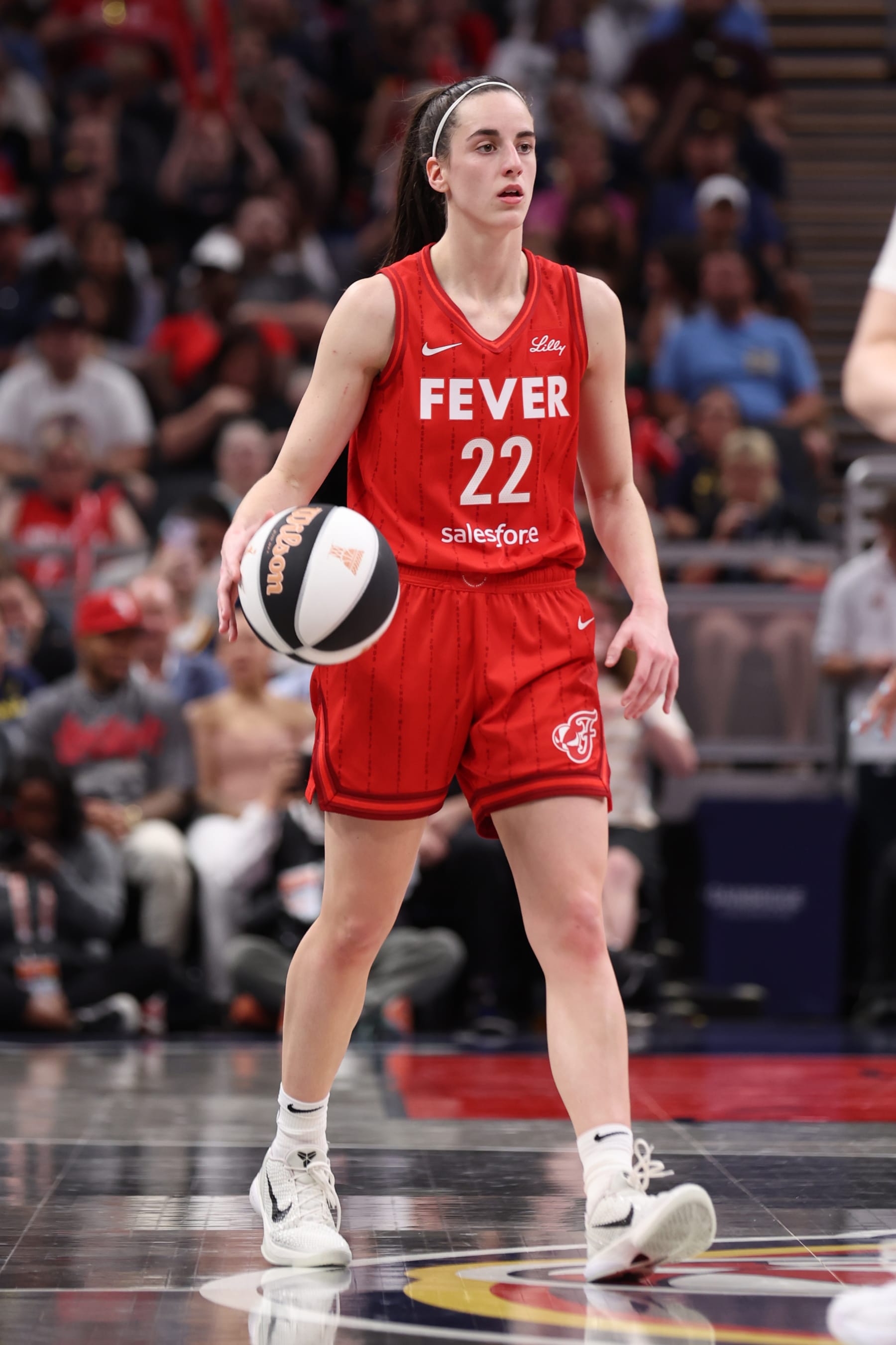 INDIANAPOLIS, IN - JUNE 13: Caitlin Clark #22 of the Indiana Fever dribbles the ball during the game against the Atlanta Dream on June 13, 2024 at Gainbridge Fieldhouse in Indianapolis, Indiana. NOTE TO USER: User expressly acknowledges and agrees that, by downloading and or using this Photograph, user is consenting to the terms and conditions of the Getty Images License Agreement. Mandatory Copyright Notice: Copyright 2024 NBAE (Photo by Pepper Robinson/NBAE via Getty Images)