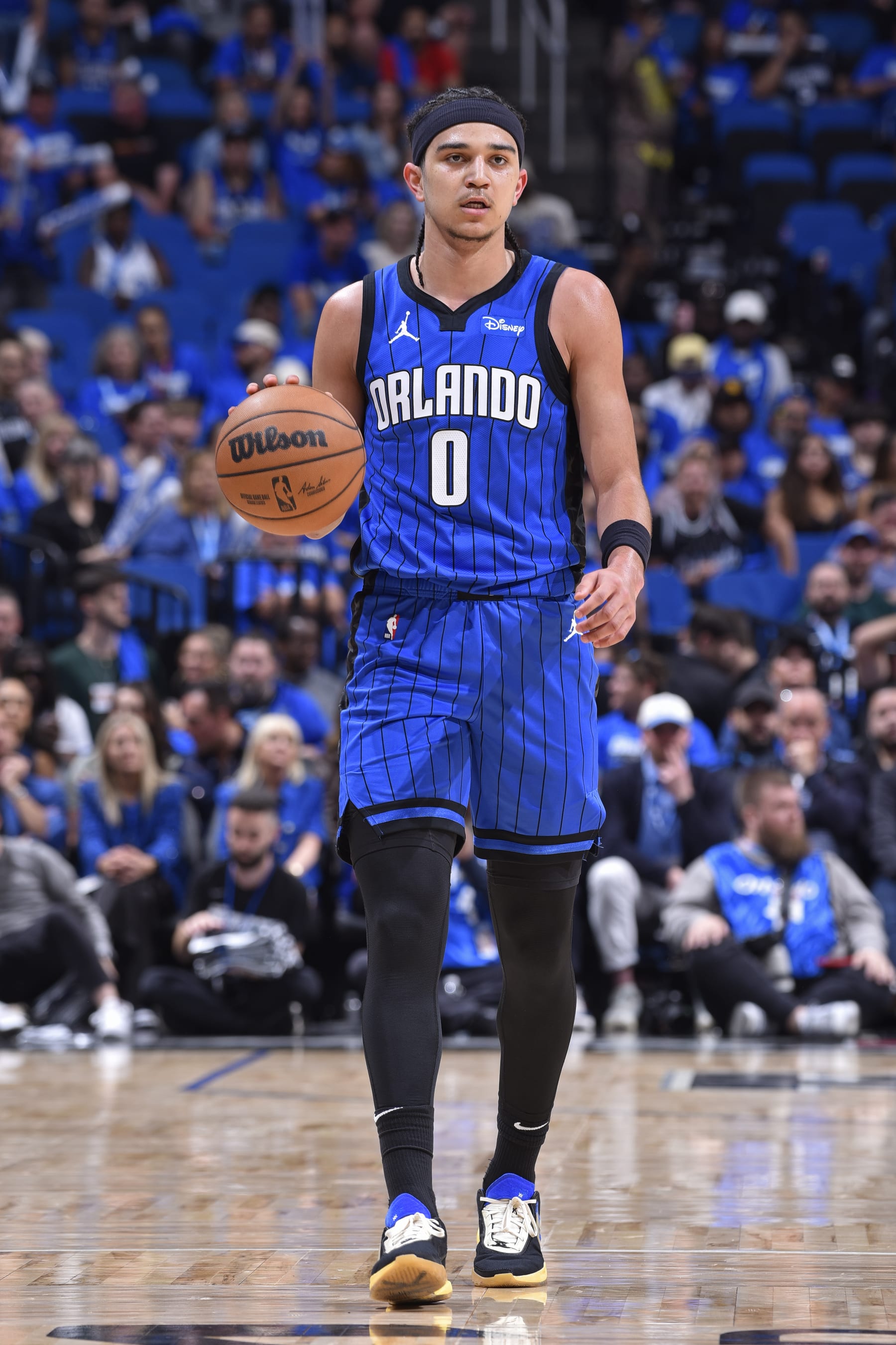 ORLANDO, FL - APRIL 25: Anthony Black #0 of the Orlando Magic brings the ball up court during Round 1 Game 3 of the 2024 NBA Playoffs against the Cleveland Cavaliers on April 25, 2024 at the Kia Center in Orlando, Florida. NOTE TO USER: User expressly acknowledges and agrees that, by downloading and or using this photograph, User is consenting to the terms and conditions of the Getty Images License Agreement. Mandatory Copyright Notice: Copyright 2024 NBAE (Photo by Gary Bassing/NBAE via Getty Images)