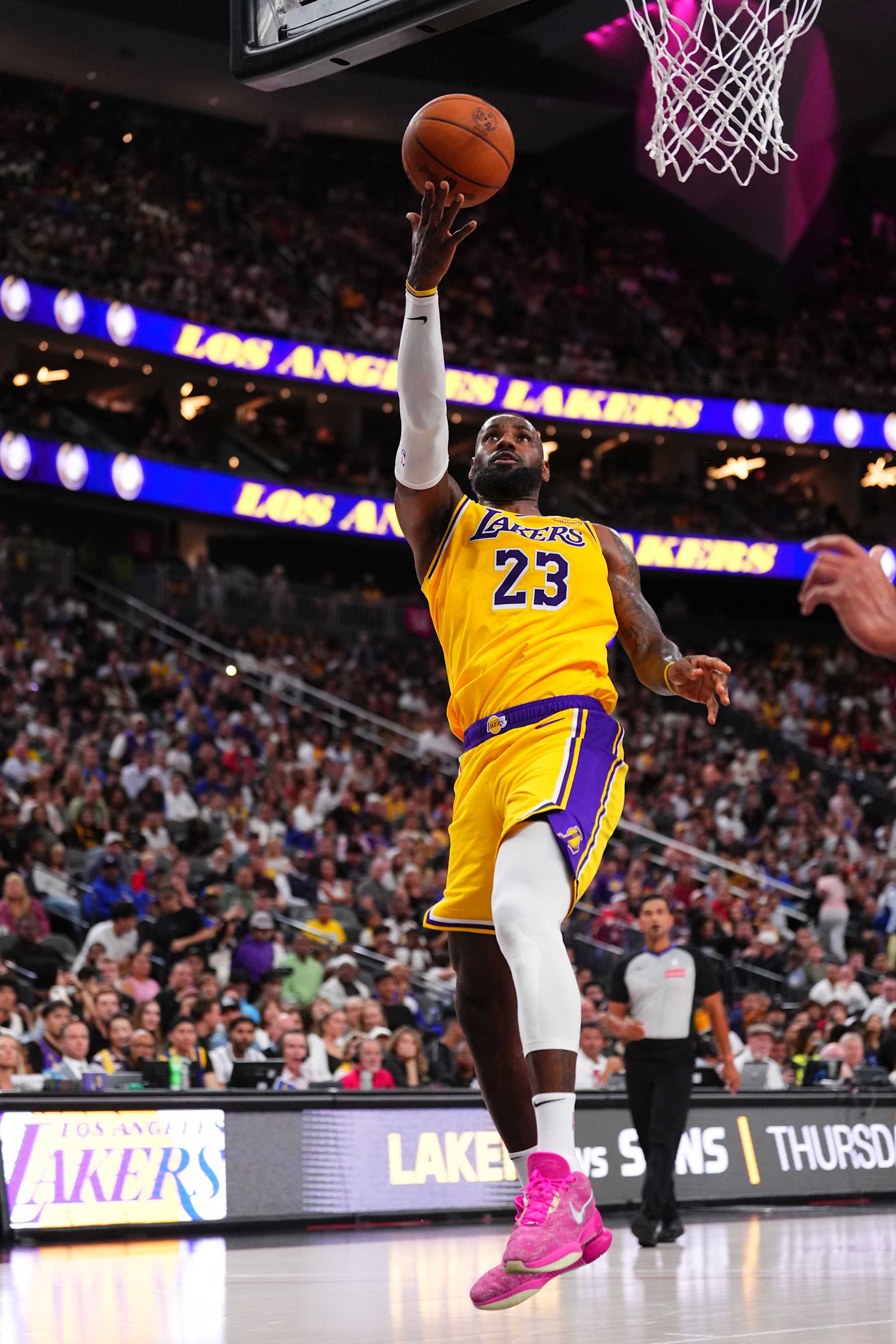 LAS VEGAS, NV - OCTOBER 15: LeBron James #23 of the Los Angeles Lakers drives to the basket during the game against the Golden State Warriors during the 2024 NBA Preseason on October 15, 2024 at T-Mobile Arena in Las Vegas, Nevada. NOTE TO USER: User expressly acknowledges and agrees that, by downloading and or using this photograph, User is consenting to the terms and conditions of the Getty Images License Agreement. Mandatory Copyright Notice: Copyright 2024 NBAE  (Photo by Jeff Bottari/NBAE via Getty Images)