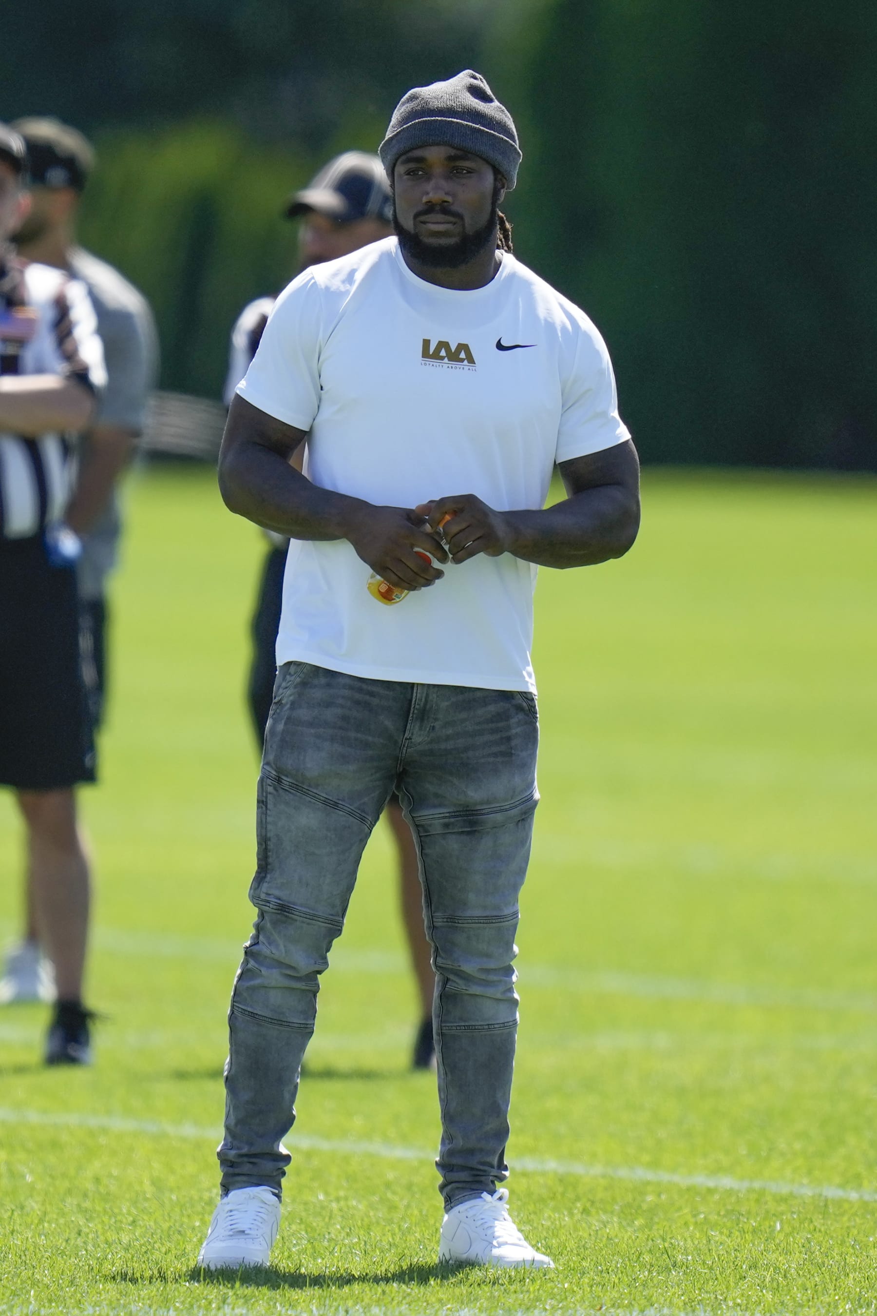 Running back Dalvin Cook watches a New York Jets practice at the NFL football team's training facility in Florham Park, N.J., Sunday, July 30, 2023. (AP Photo/Seth Wenig)