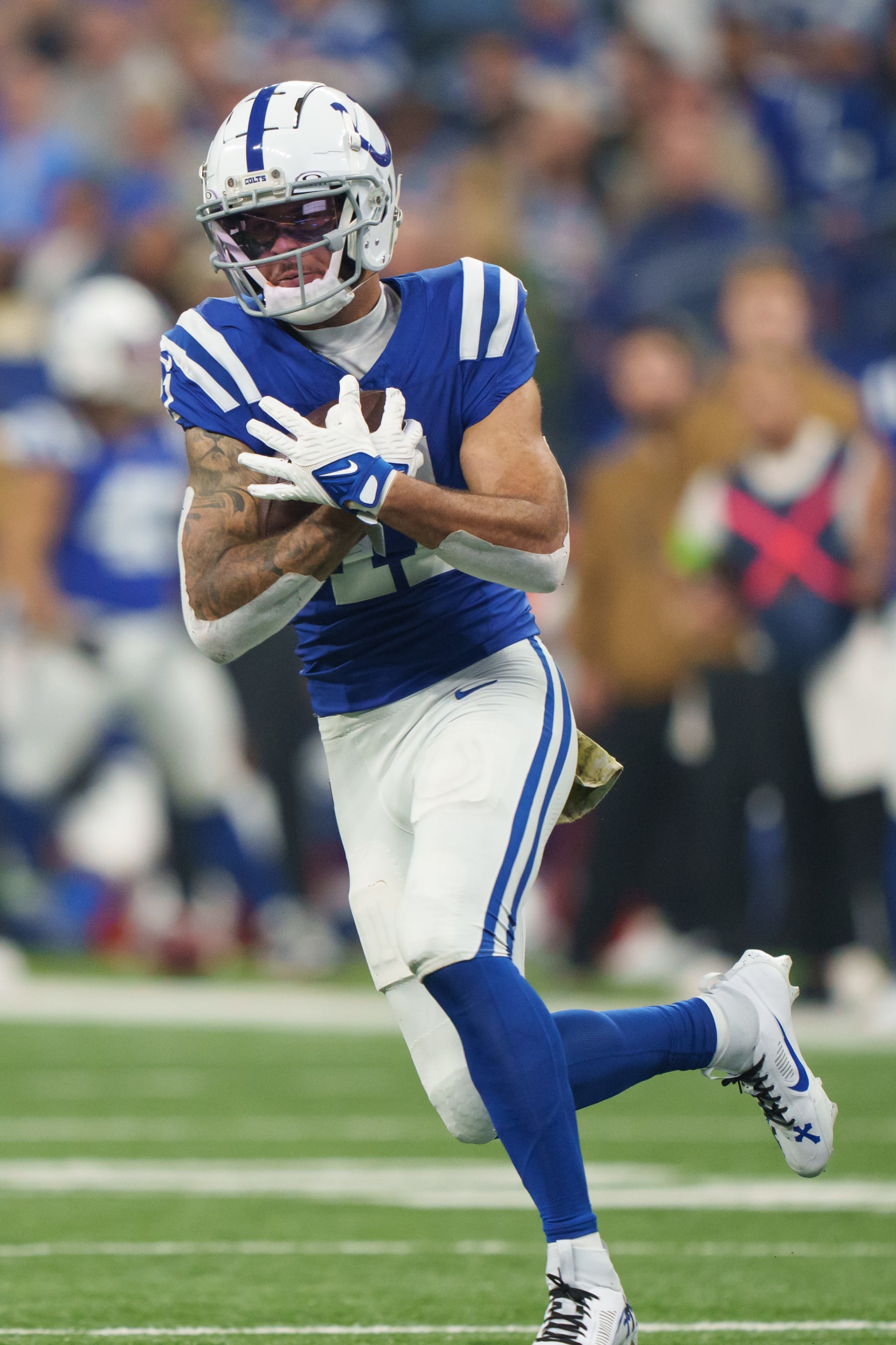 INDIANAPOLIS, INDIANA - NOVEMBER 26: Wide receiver Michael Pittman Jr. #11 of the Indianapolis Colts catches a pass during the first half of an NFL football game against the Tampa Bay Buccaneers on November 26, 2023 in Indianapolis, Indiana. The Colts beat the Buccaneers 27-20. (Photo by Todd Rosenberg/Getty Images)