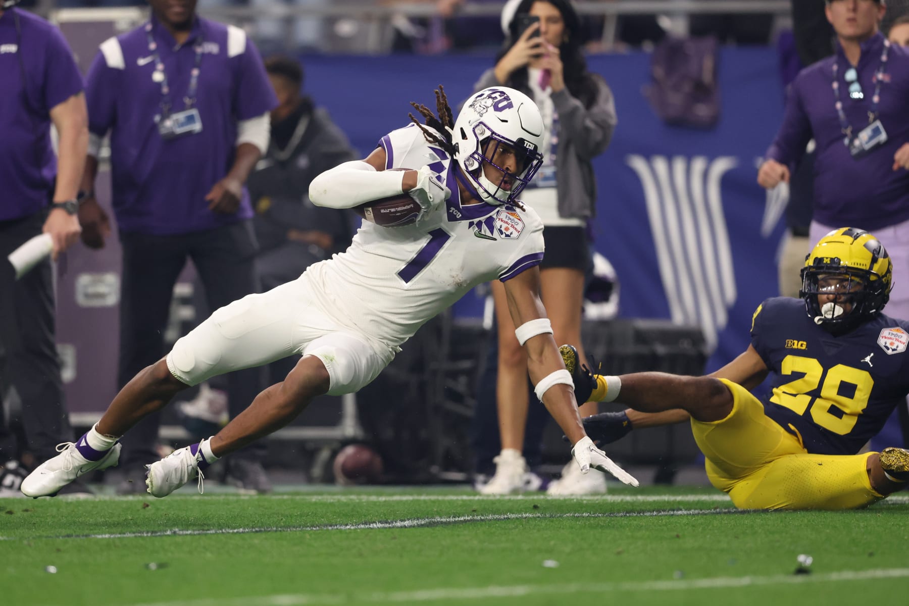 GLENDALE, ARIZONA - DECEMBER 31: Quentin Johnston #1 of the TCU Horned Frogs runs after catching a pass during the second quarter in the Vrbo Fiesta Bowl at State Farm Stadium on December 31, 2022 in Glendale, Arizona. (Photo by Christian Petersen/Getty Images)