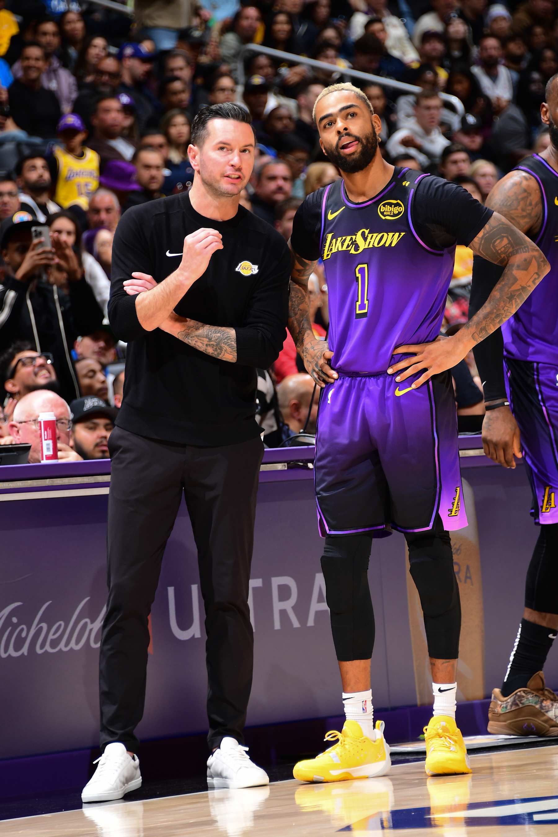 LOS ANGELES, CA - NOVEMBER 21: D'Angelo Russell #1 and Head Coach JJ Redick of the Los Angeles Lakers talk during the game against the Orlando Magic on November 21, 2024 at Crypto.Com Arena in Los Angeles, California. NOTE TO USER: User expressly acknowledges and agrees that, by downloading and/or using this Photograph, user is consenting to the terms and conditions of the Getty Images License Agreement. Mandatory Copyright Notice: Copyright 2024 NBAE (Photo by Adam Pantozzi/NBAE via Getty Images)