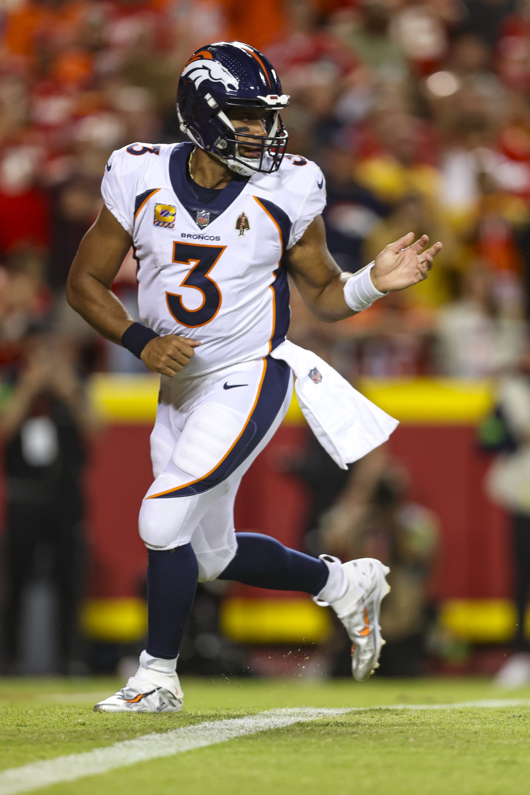KANSAS CITY, MO - OCTOBER 12: Russell Wilson #3 of the Denver Broncos hands off the ball during an NFL football game against the Kansas City Chiefs at GEHA Field at Arrowhead Stadium on October 12, 2023 in Kansas City, Missouri. (Photo by Perry Knotts/Getty Images)