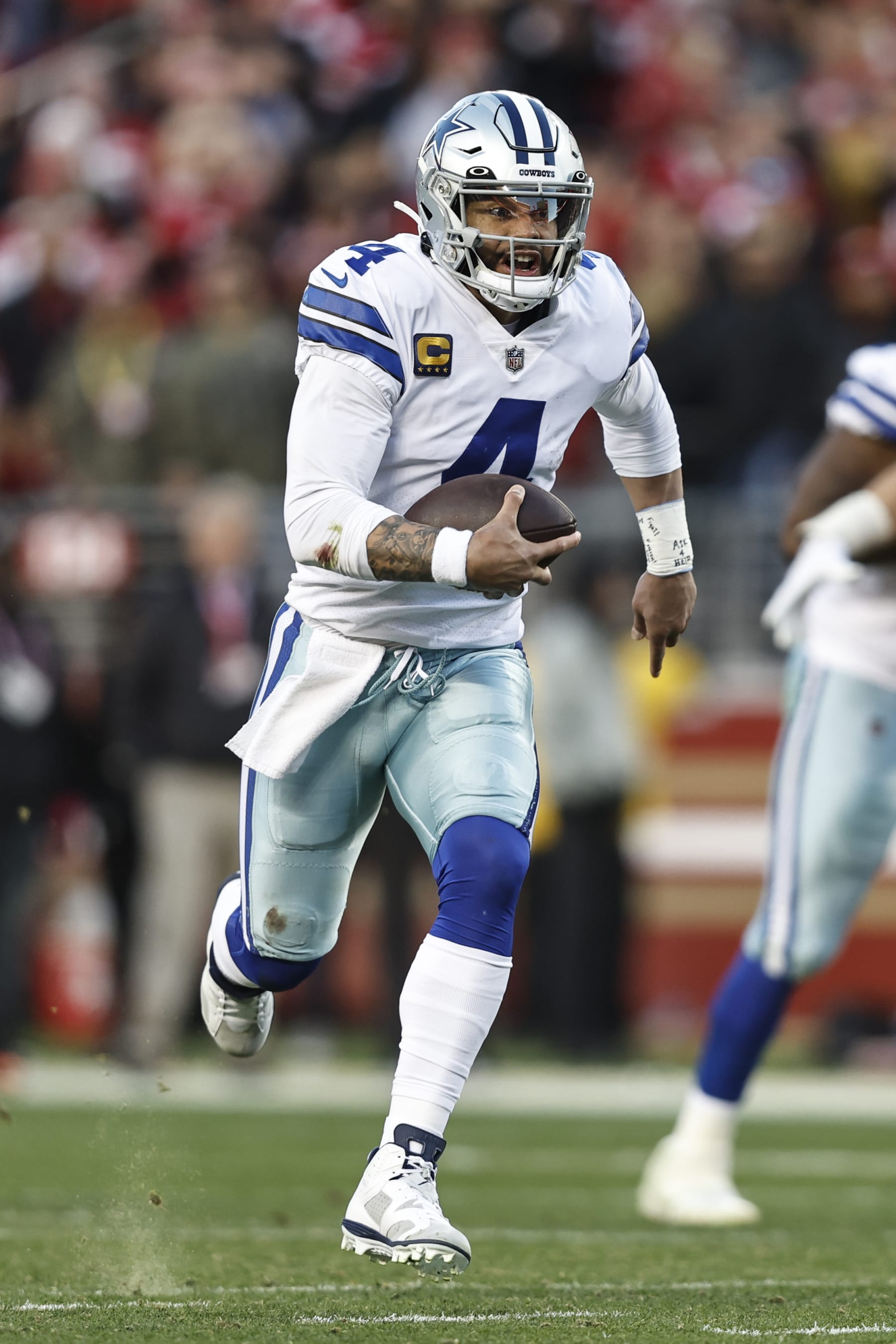 SANTA CLARA, CALIFORNIA - JANUARY 22: Dak Prescott #4 of the Dallas Cowboys scrambles and runs with the ball during an NFL divisional round playoff football game between the San Francisco 49ers and the Dallas Cowboys at Levi's Stadium on January 22, 2023 in Santa Clara, California. (Photo by Michael Owens/Getty Images)