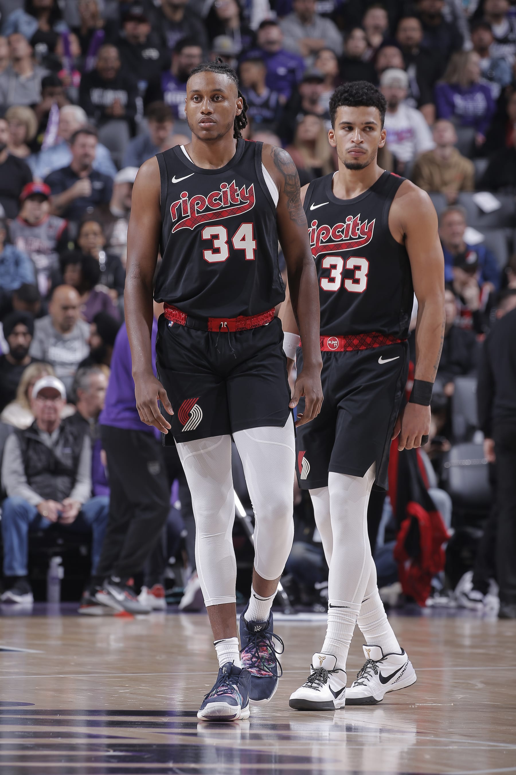 SACRAMENTO, CA - NOVEMBER 8: Jabari Walker #34  and Toumani Camara #33 of the Portland Trail Blazers look on during the game against the Sacramento Kings on November 8, 2023 at Golden 1 Center in Sacramento, California. NOTE TO USER: User expressly acknowledges and agrees that, by downloading and or using this photograph, User is consenting to the terms and conditions of the Getty Images Agreement. Mandatory Copyright Notice: Copyright 2023 NBAE (Photo by Rocky Widner/NBAE via Getty Images)