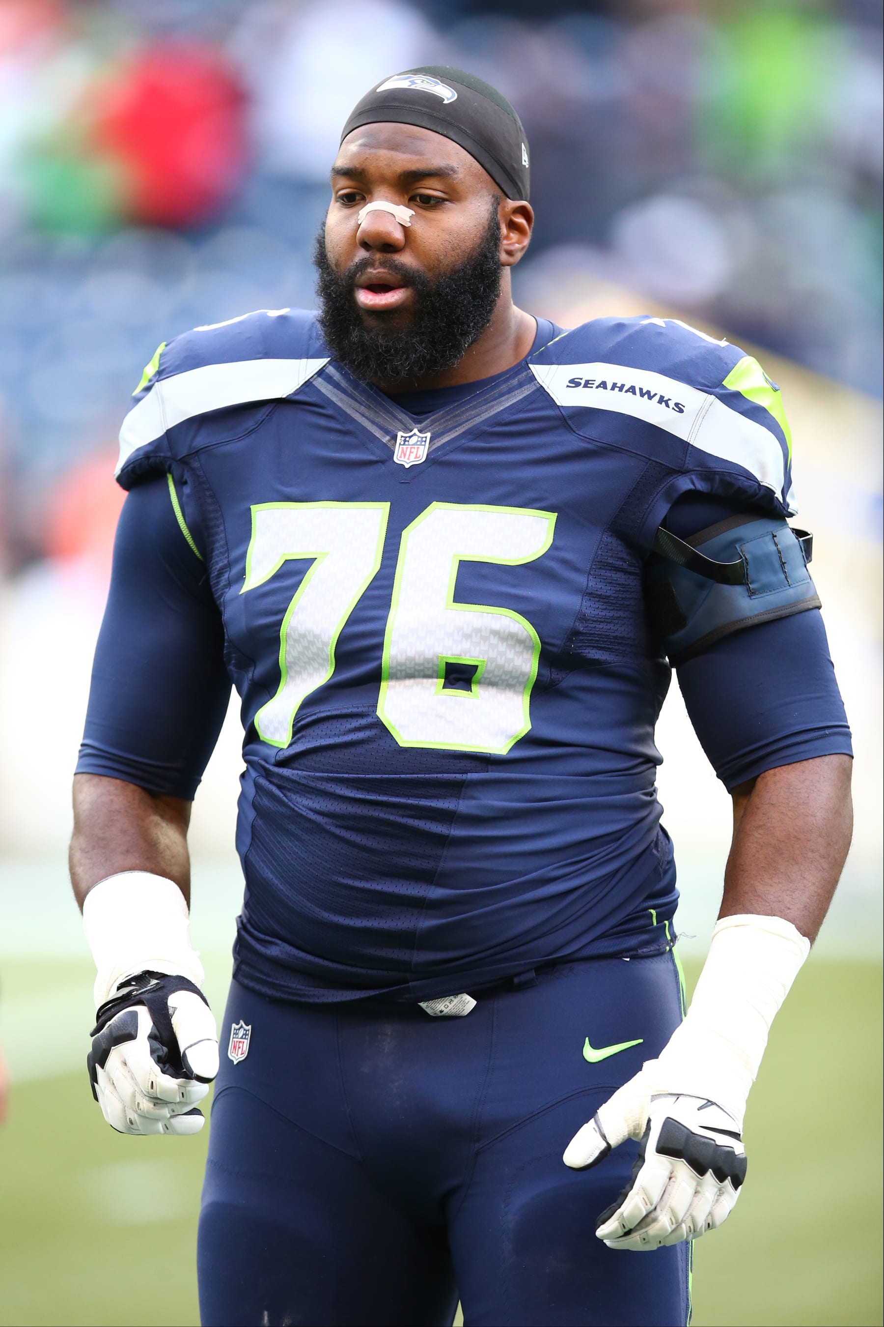SEATTLE, WA - DECEMBER 20:  Russell Okung #76 of the Seattle Seahawks looks on before the game against the Cleveland Browns at CenturyLink Field on December 20, 2015 in Seattle, Washington.  The Seahawks defeated the Browns 30-13.  (Photo by Rob Leiter via Getty Images)