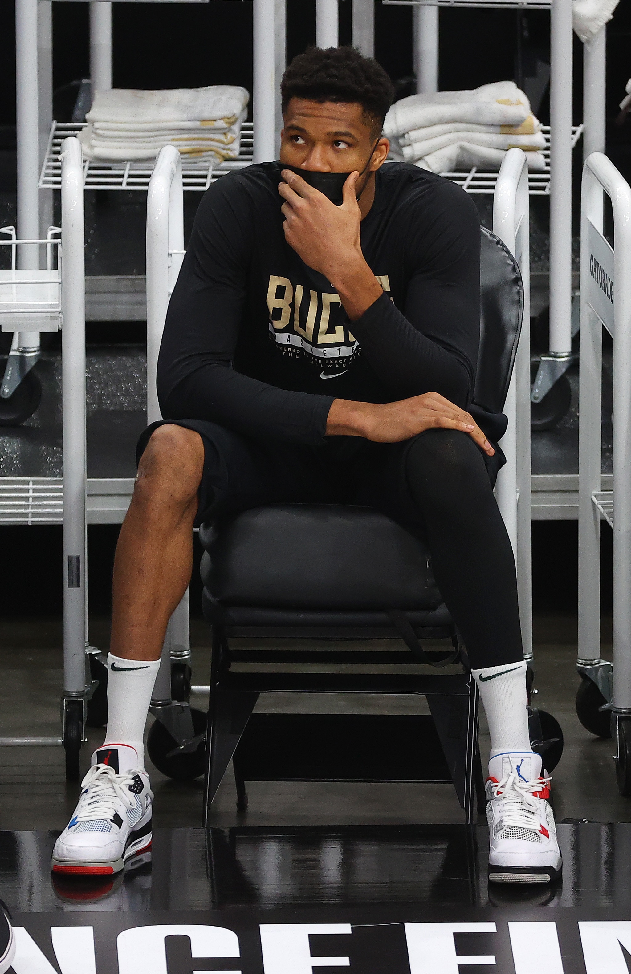 ATLANTA, GEORGIA - JULY 03: Giannis Antetokounmpo #34 of the Milwaukee Bucks looks on from the sidelines during the first half in Game Six of the Eastern Conference Finals against the Atlanta Hawks at State Farm Arena on July 03, 2021 in Atlanta, Georgia NOTE TO USER: User expressly acknowledges and agrees that, by downloading and or using this photograph, User is consenting to the terms and conditions of the Getty Images License Agreement. (Photo by Kevin C. Cox/Getty Images)