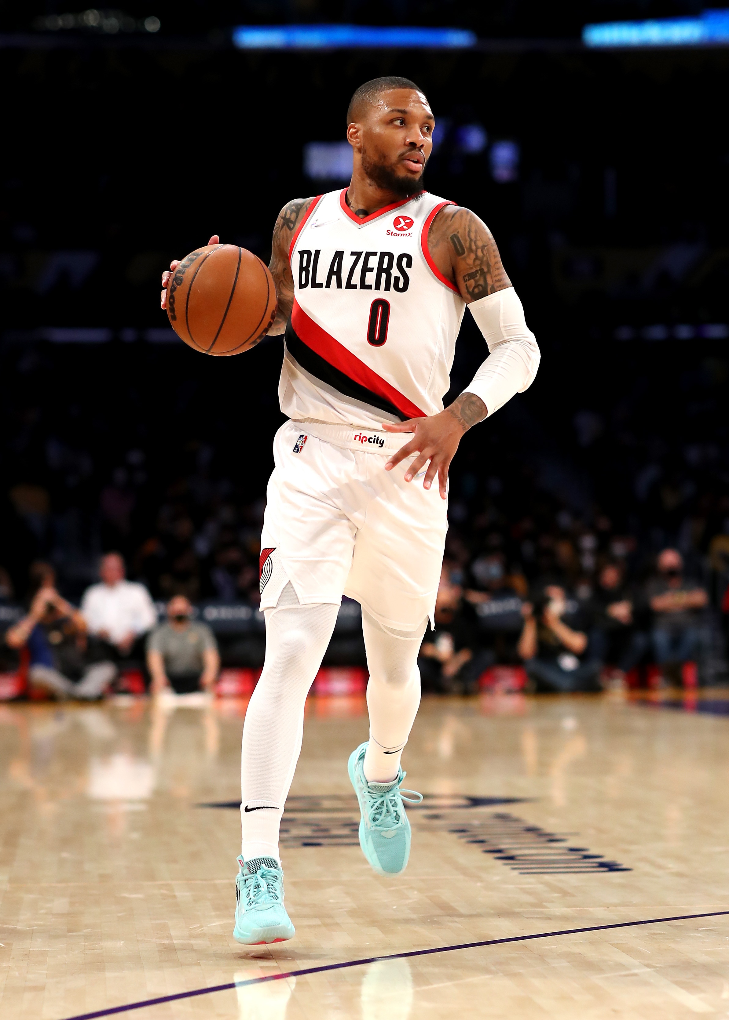 LOS ANGELES, CALIFORNIA - DECEMBER 31: Damian Lillard #0 of the Portland Trail Blazers handles the ball during the first quarter against the Los Angeles Lakers at Crypto.com Arena on December 31, 2021 in Los Angeles, California. NOTE TO USER: User expressly acknowledges and agrees that, by downloading and or using this photograph, User is consenting to the terms and conditions of the Getty Images License Agreement. (Photo by Katelyn Mulcahy/Getty Images)