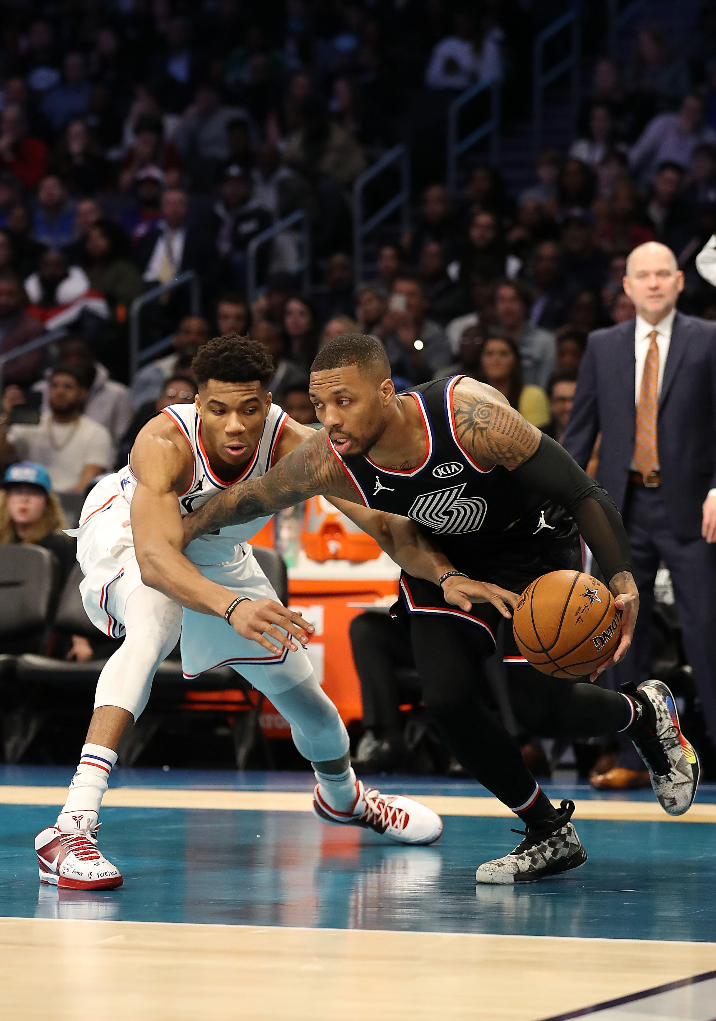 CHARLOTTE, NORTH CAROLINA - FEBRUARY 17: Damian Lillard #0 of the Portland Trail Blazers and Team LeBron drives against Giannis Antetokounmpo #34 of the Milwaukee Bucks and Team Giannis in the fourth quarter during the NBA All-Star game as part of the 2019 NBA All-Star Weekend at Spectrum Center on February 17, 2019 in Charlotte, North Carolina. Team LeBron won 178-164. NOTE TO USER: User expressly acknowledges and agrees that, by downloading and/or using this photograph, user is consenting to the terms and conditions of the Getty Images License Agreement.  (Photo by Streeter Lecka/Getty Images)