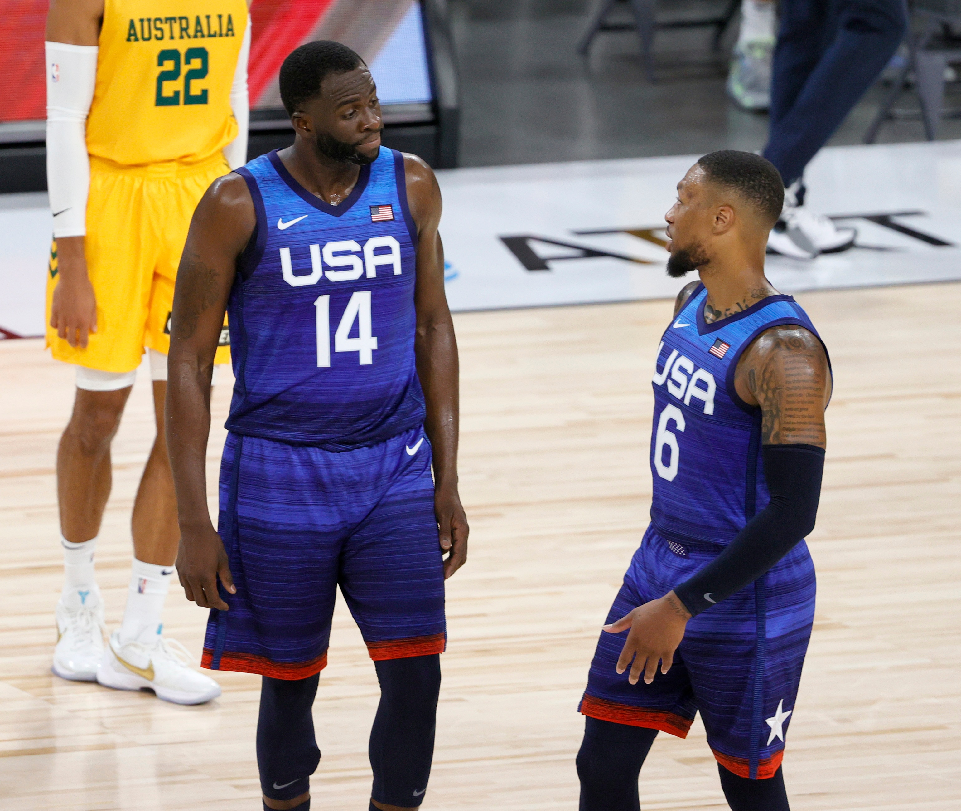 LAS VEGAS, NEVADA - JULY 12:  Draymond Green #14 and Damian Lillard #6 of the United States talk during an exhibition game against the Australia Boomers at Michelob Ultra Arena ahead of the Tokyo Olympic Games on July 12, 2021 in Las Vegas, Nevada. Australia defeated the United States 91-83.  (Photo by Ethan Miller/Getty Images)
