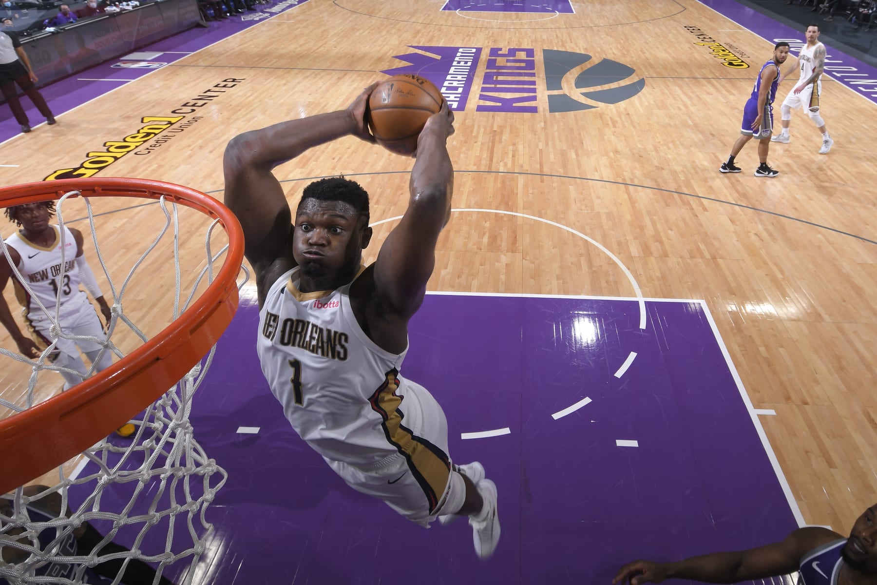 SACRAMENTO, CA - JANUARY 17: Zion Williamson #1 of the New Orleans Pelicans dunks the ball against the Sacramento Kings on January 17, 2021 at Golden 1 Center in Sacramento, California. NOTE TO USER: User expressly acknowledges and agrees that, by downloading and or using this Photograph, user is consenting to the terms and conditions of the Getty Images License Agreement. Mandatory Copyright Notice: Copyright 2021 NBAE (Photo by Rocky Widner/NBAE via Getty Images)