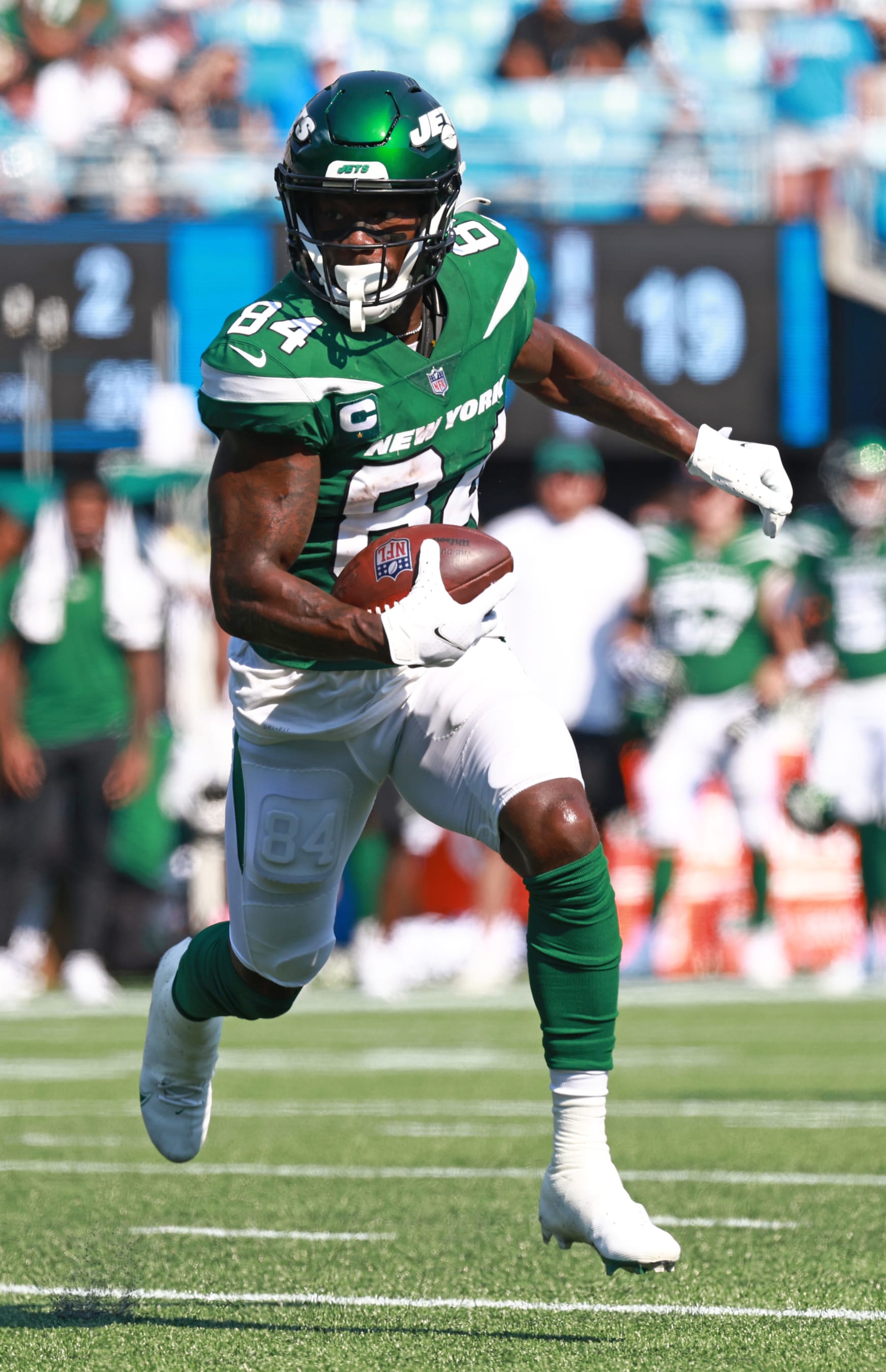 CHARLOTTE, NORTH CAROLINA - SEPTEMBER 12: Corey Davis #84 of the New York Jets runs with the ball after a reception against the Carolina Panthers during the second half at Bank of America Stadium on September 12, 2021 in Charlotte, North Carolina. (Photo by Grant Halverson/Getty Images)