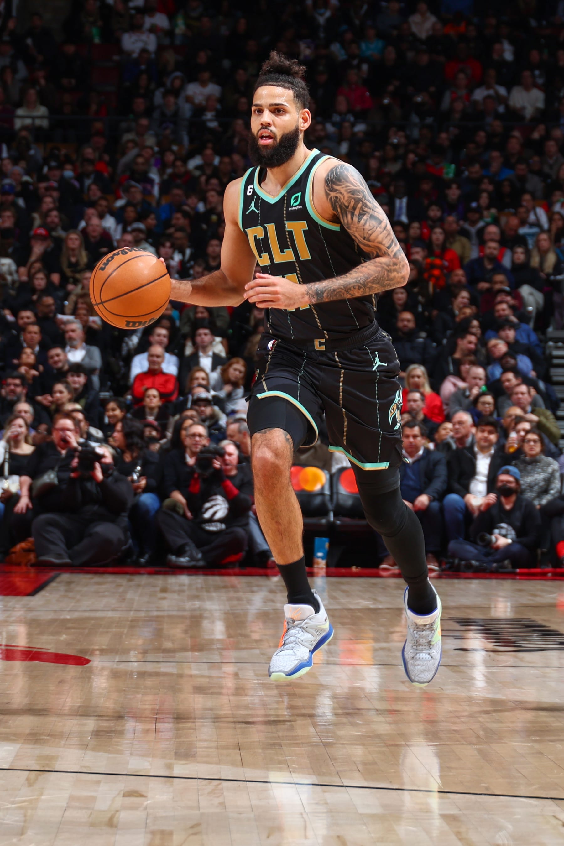 TORONTO, CANADA - JANUARY 10:  Cody Martin #11 of the Charlotte Hornets handles the ball during the game against the  Toronto Raptors on January 10, 2023 at the Scotiabank Arena in Toronto, Ontario, Canada.  NOTE TO USER: User expressly acknowledges and agrees that, by downloading and or using this Photograph, user is consenting to the terms and conditions of the Getty Images License Agreement.  Mandatory Copyright Notice: Copyright 2023 NBAE (Photo by Vaughn Ridley/NBAE via Getty Images)