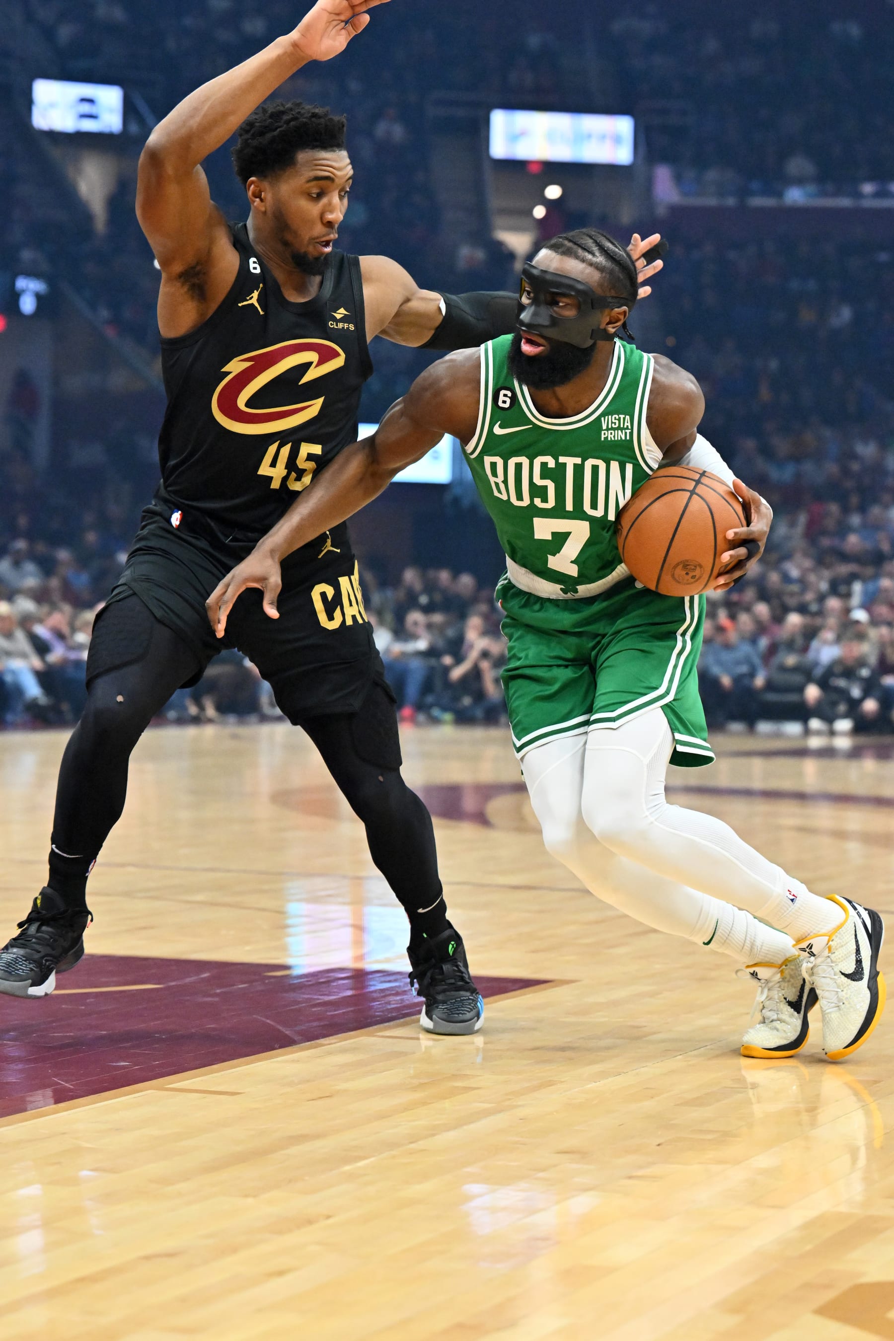 CLEVELAND, OHIO - MARCH 06: Jaylen Brown #7 of the Boston Celtics drives around Donovan Mitchell #45 of the Cleveland Cavaliers during the first quarter at Rocket Mortgage Fieldhouse on March 06, 2023 in Cleveland, Ohio. NOTE TO USER: User expressly acknowledges and agrees that, by downloading and or using this photograph, User is consenting to the terms and conditions of the Getty Images License Agreement. (Photo by Jason Miller/Getty Images)