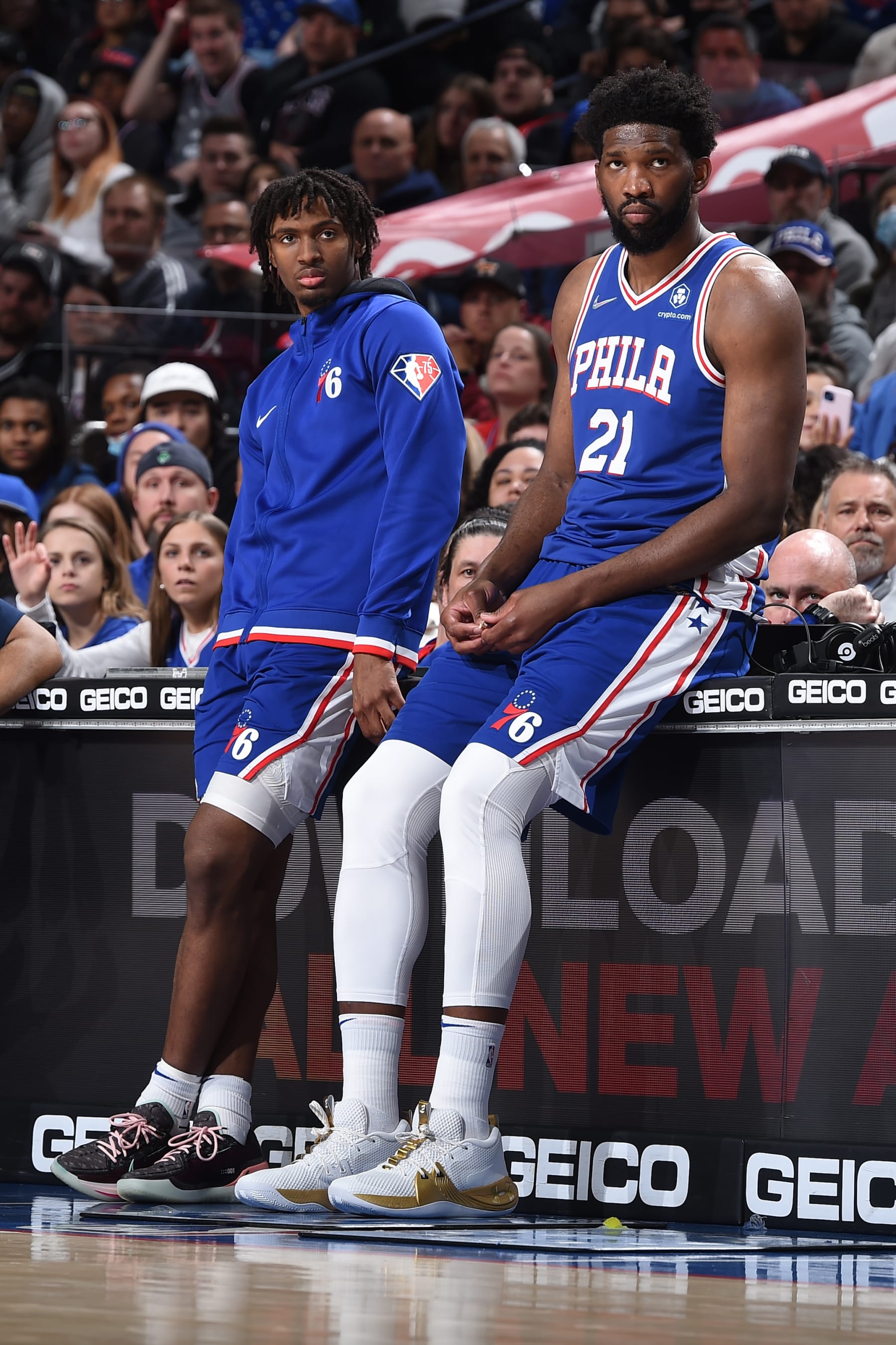 PHILADELPHIA, PA - MARCH 20: Tyrese Maxey #0 and Joel Embiid #21 of the Philadelphia 76ers look on during the game against the Toronto Raptors on March 20, 2022 at the Wells Fargo Center in Philadelphia, Pennsylvania NOTE TO USER: User expressly acknowledges and agrees that, by downloading and/or using this Photograph, user is consenting to the terms and conditions of the Getty Images License Agreement. Mandatory Copyright Notice: Copyright 2022 NBAE (Photo by David Dow/NBAE via Getty Images)