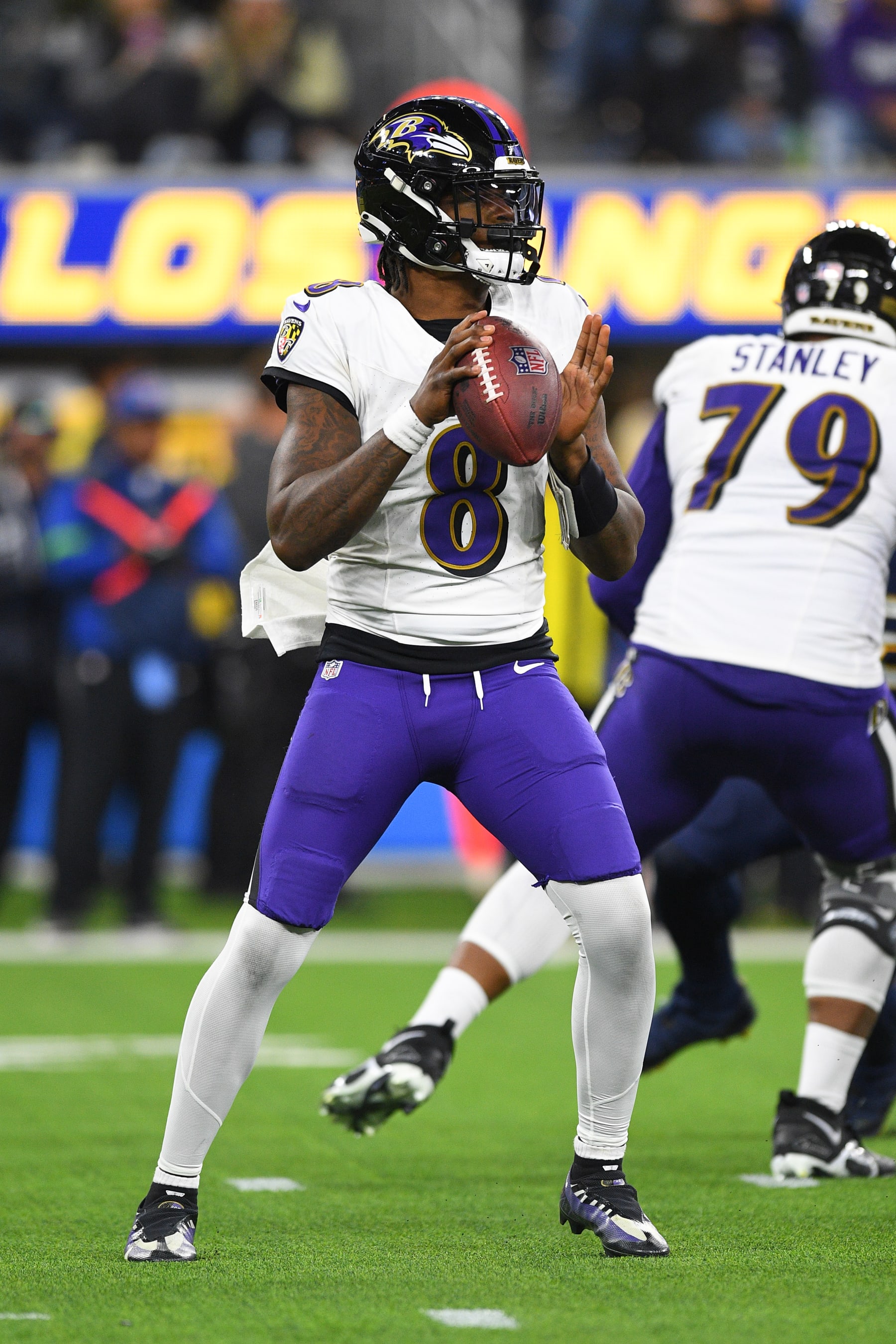 INGLEWOOD, CA - NOVEMBER 26: Baltimore Ravens quarterback Lamar Jackson (8) drops back to pass during the NFL regular season game between the Baltimore Ravens and the Los Angeles Chargers on November 26, 2023, at SoFi Stadium in Inglewood, CA. (Photo by Brian Rothmuller/Icon Sportswire via Getty Images) INGLEWOOD, CA - NOVEMBER 26: Baltimore Ravens quarterback Lamar Jackson (8) drops back to pass during the NFL regular season game between the Baltimore Ravens and the Los Angeles Chargers on November 26, 2023, at SoFi Stadium in Inglewood, CA. (Photo by Brian Rothmuller/Icon Sportswire via Getty Images)