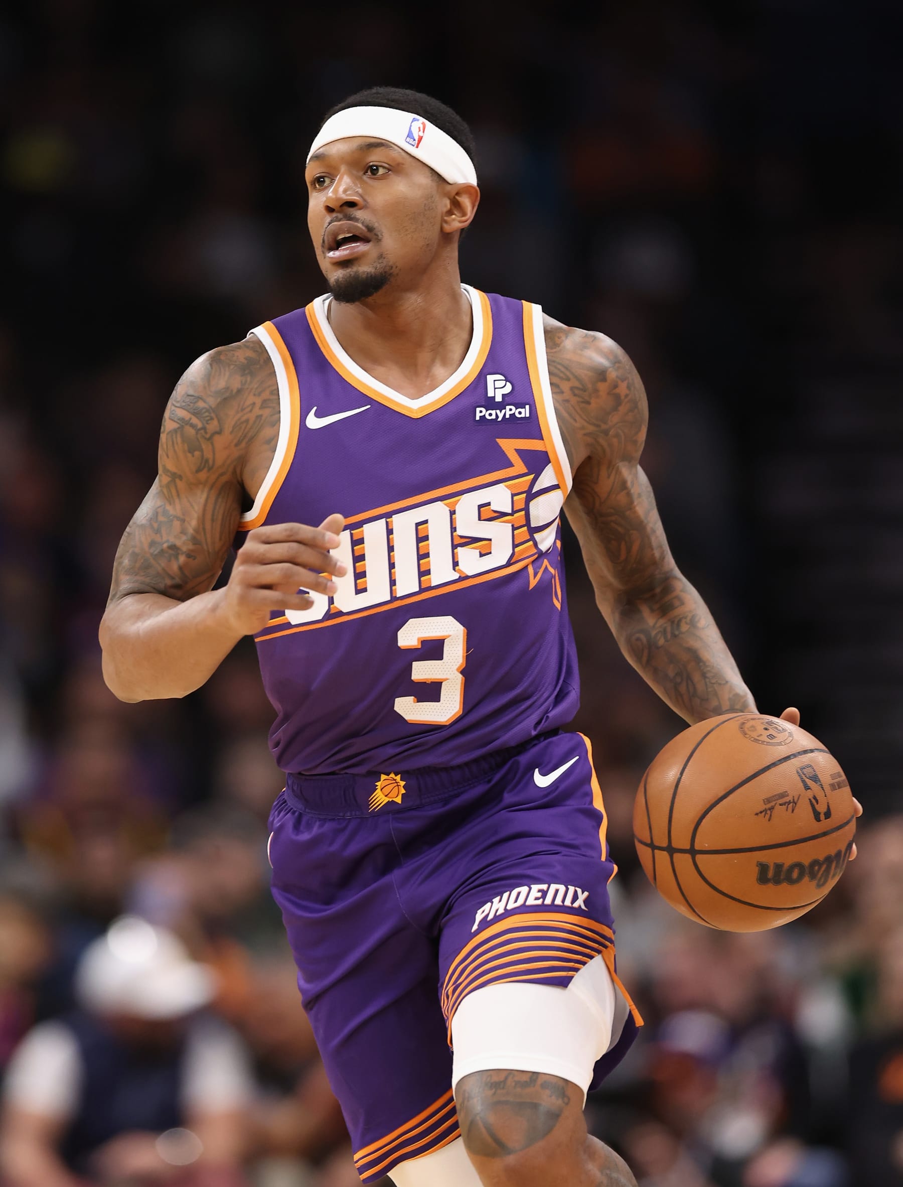 PHOENIX, ARIZONA - DECEMBER 12: Bradley Beal #3 of the Phoenix Suns handles the ball during the first half of the NBA game against the Golden State Warriors at Footprint Center on December 12, 2023 in Phoenix, Arizona.  The Suns defeated the Warriors 119-116. NOTE TO USER: User expressly acknowledges and agrees that, by downloading and or using this photograph, User is consenting to the terms and conditions of the Getty Images License Agreement.  (Photo by Christian Petersen/Getty Images)