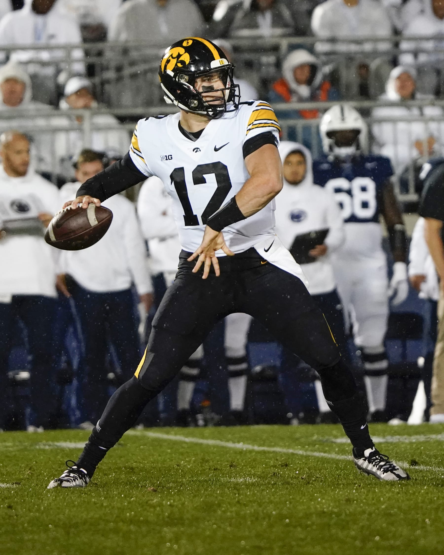UNIVERSITY PARK, PA - SEPTEMBER 23: Iowa Hawkeyes Quarterback Cade McNamara (12) throws the ball during the first half of the College Football game between the Iowa Hawkeyes and Penn State Nittany Lions on September 23,2023, at Beaver Stadium in University Park, PA. (Photo by Gregory Fisher/Icon Sportswire via Getty Images)