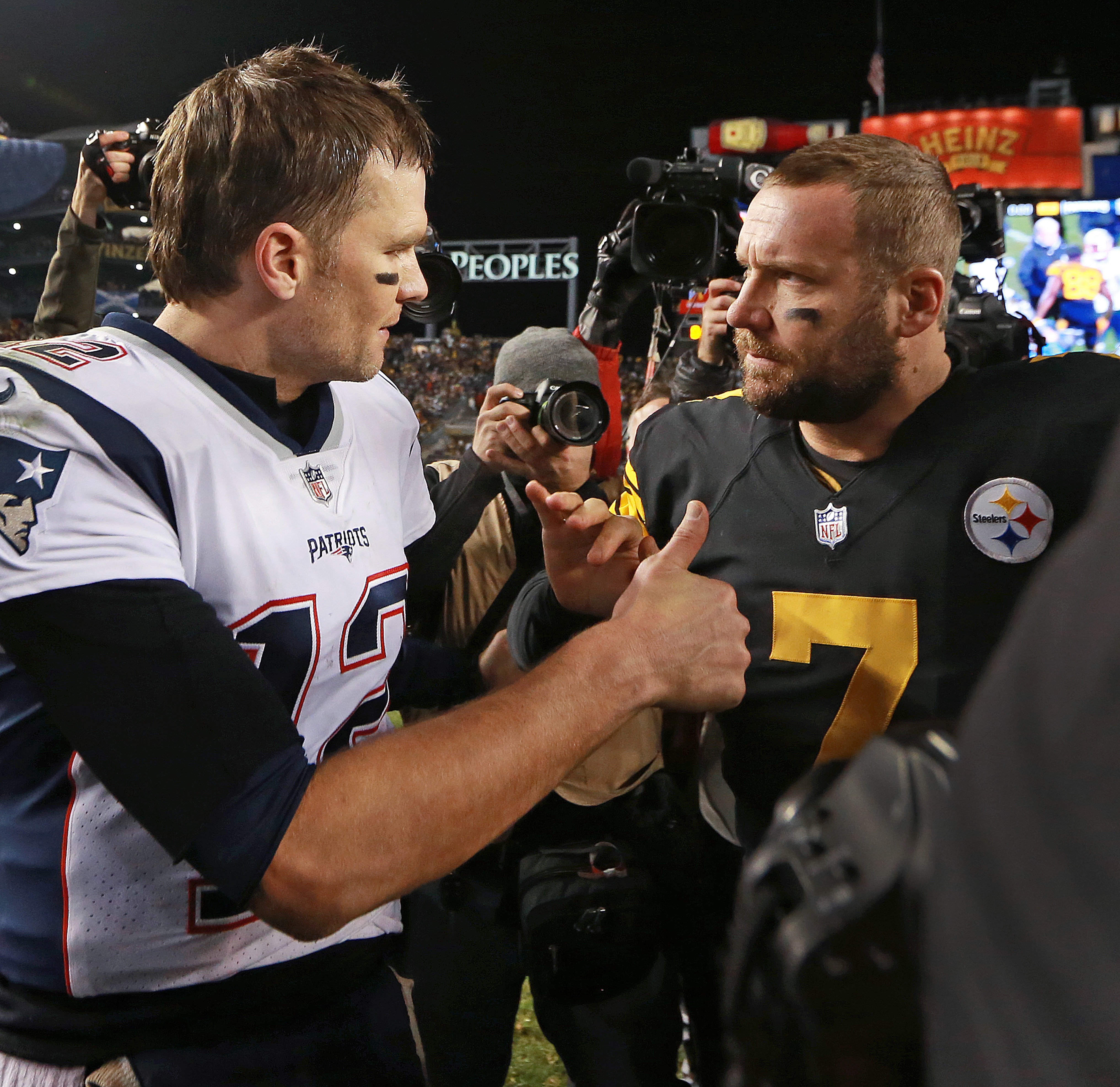 PITTSBURGH, PA - DECEMBER 16: New England Patriots quarterback Tom Brady, left, gives a thumbs-up to Steelers quarterback Ben Roethlisberger, right, as they meet at midfield following Pittsburgh's 17-10 victory. The New England Patriots visit the Pittsburgh Steelers in a regular season NFL football game at Heinz Field in Pittsburgh, PA on Dec. 16, 2018. (Photo by Jim Davis/The Boston Globe via Getty Images)
