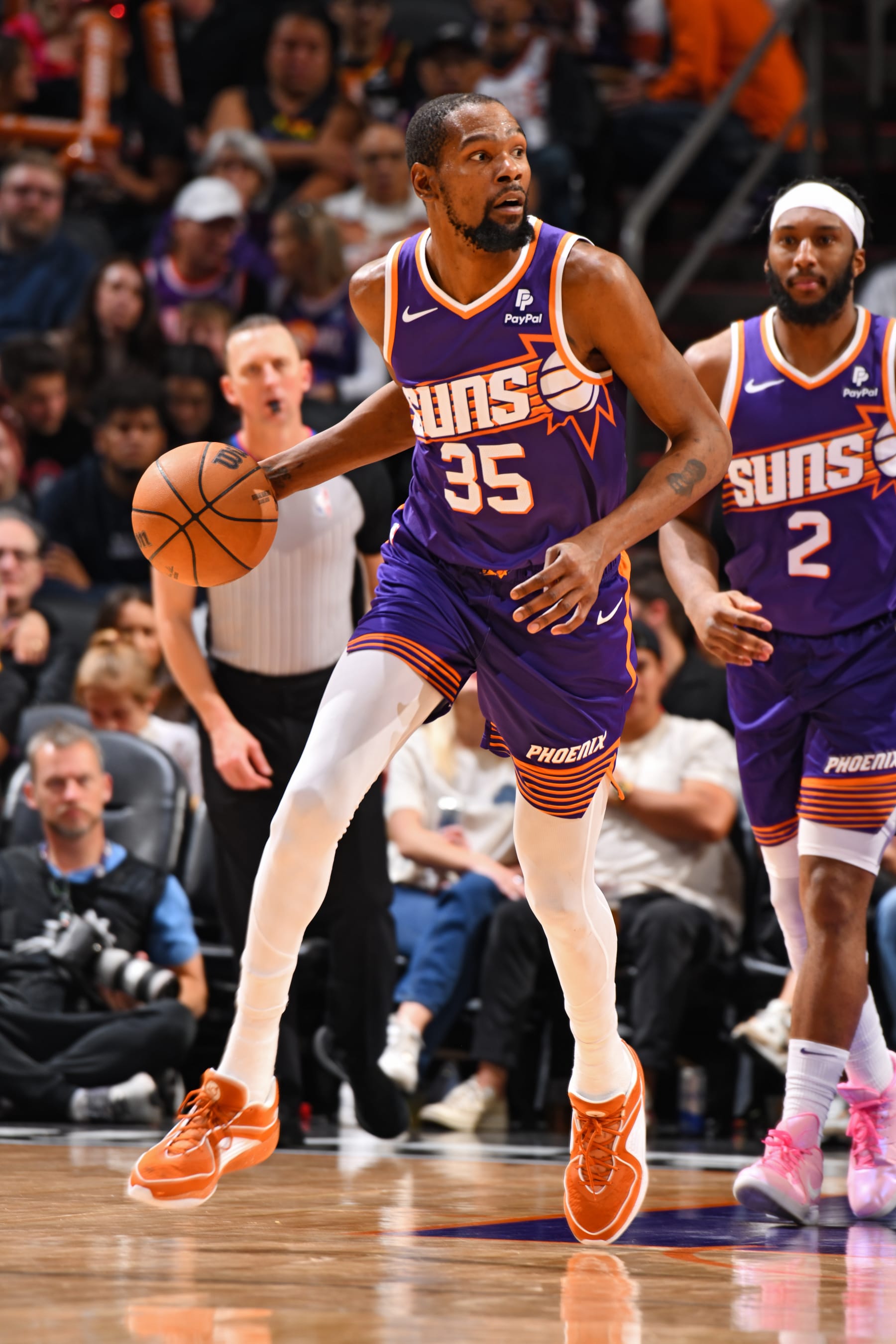 PHOENIX, AZ - FEBRUARY 14:  Kevin Durant #35 of the Phoenix Suns handles the ball during the game against the Detroit Pistons on February 14, 2024 at Footprint Center in Phoenix, Arizona. NOTE TO USER: User expressly acknowledges and agrees that, by downloading and or using this photograph, user is consenting to the terms and conditions of the Getty Images License Agreement. Mandatory Copyright Notice: Copyright 2024 NBAE (Photo by Barry Gossage/NBAE via Getty Images)
