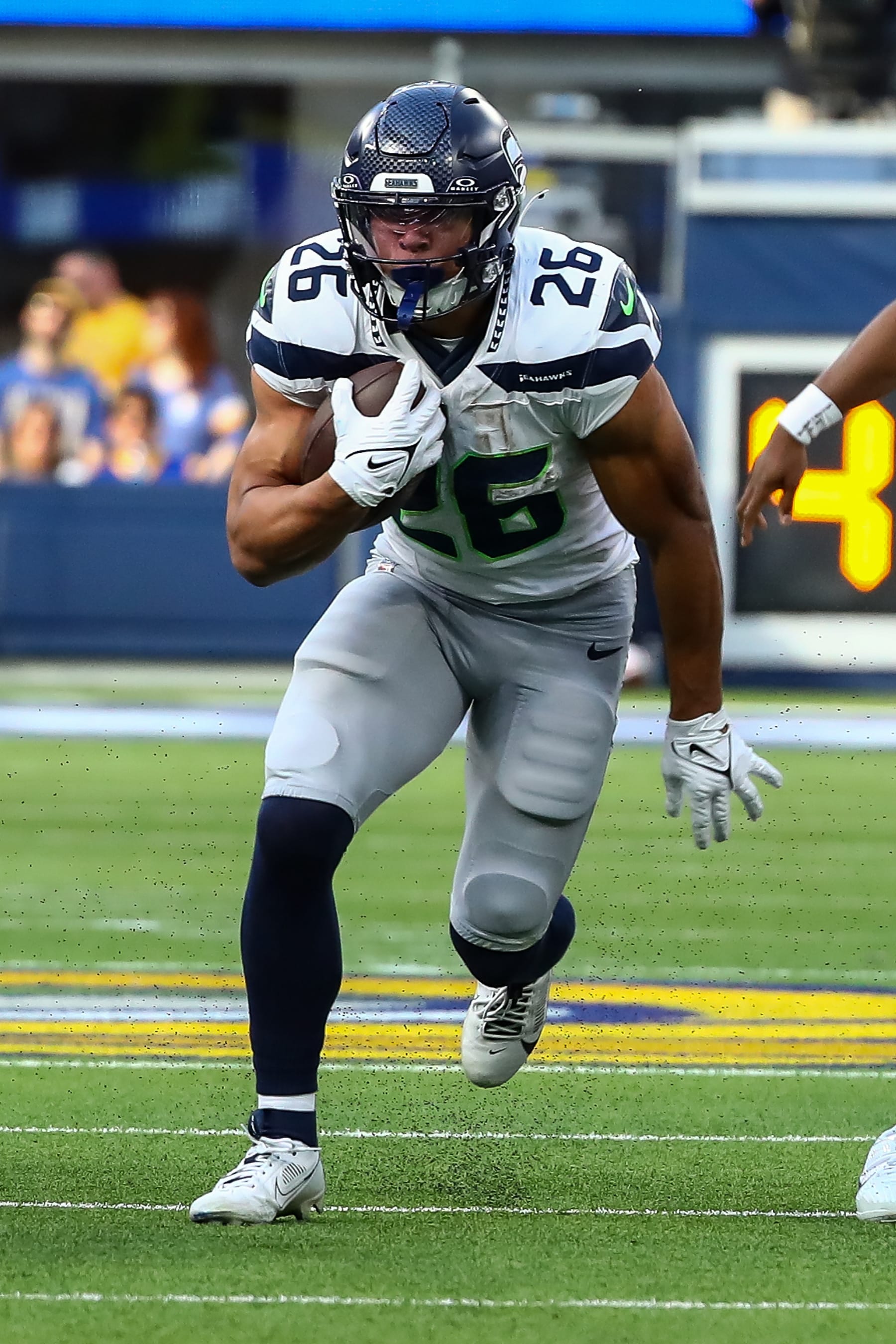 INGLEWOOD, CA - NOVEMBER 19: Seattle Seahawks running back Zach Charbonnet (26) runs the football during the Seattle Seahawks vs Los Angeles Rams game on November 19, 2023, at SoFi Stadium in Inglewood, CA. (Photo by Jevone Moore/Icon Sportswire via Getty Images)
