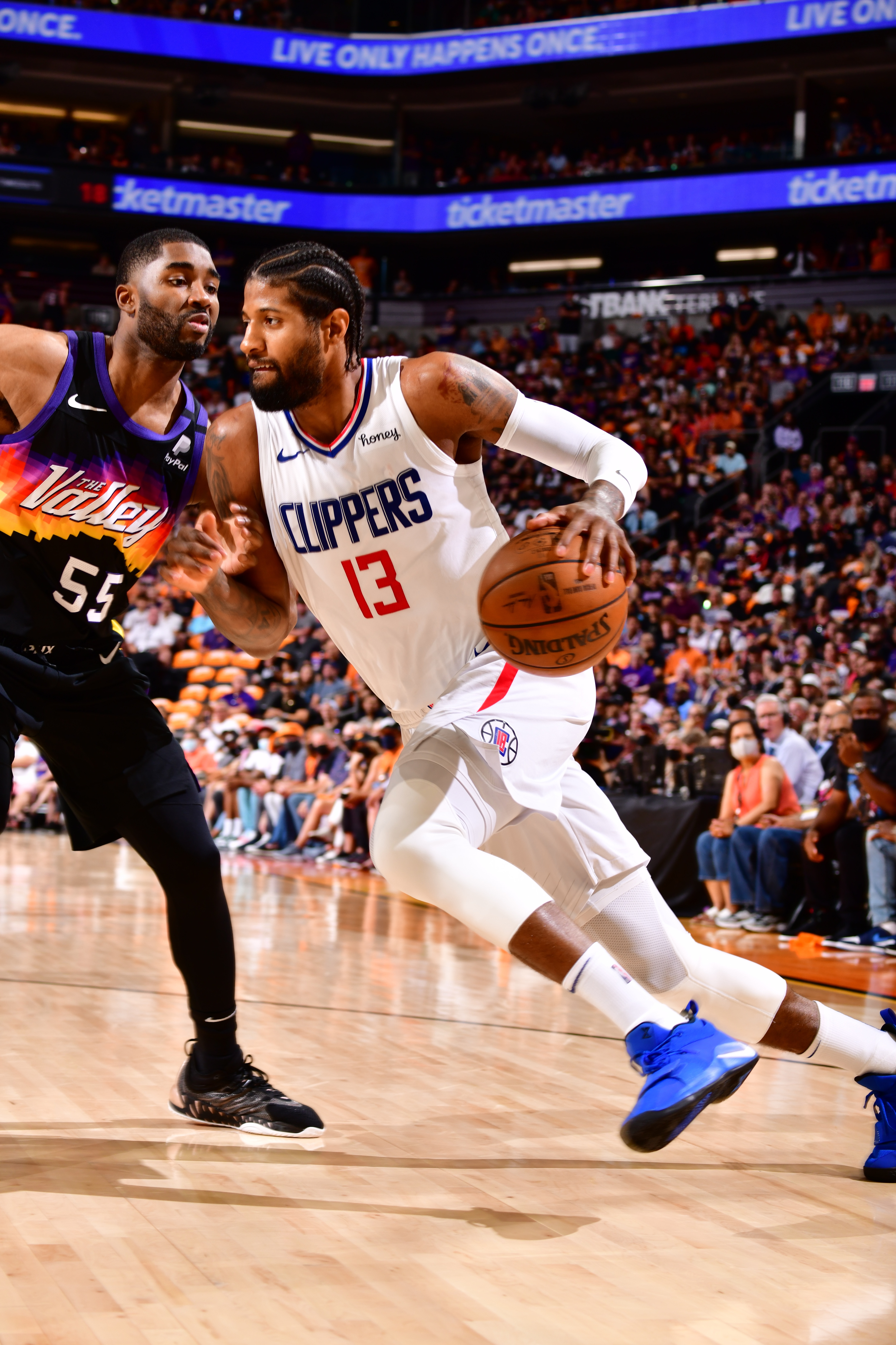PHOENIX, AZ - JUNE 20: Paul George #13 of the LA Clippers drives to the basket during the game against the Phoenix Suns during Game 1 of the Western Conference Finals of the 2021 NBA Playoffs on June 20, 2021 at Phoenix Suns Arena in Phoenix, Arizona. NOTE TO USER: User expressly acknowledges and agrees that, by downloading and or using this photograph, user is consenting to the terms and conditions of the Getty Images License Agreement. Mandatory Copyright Notice: Copyright 2021 NBAE (Photo by Barry Gossage/NBAE via Getty Images)
