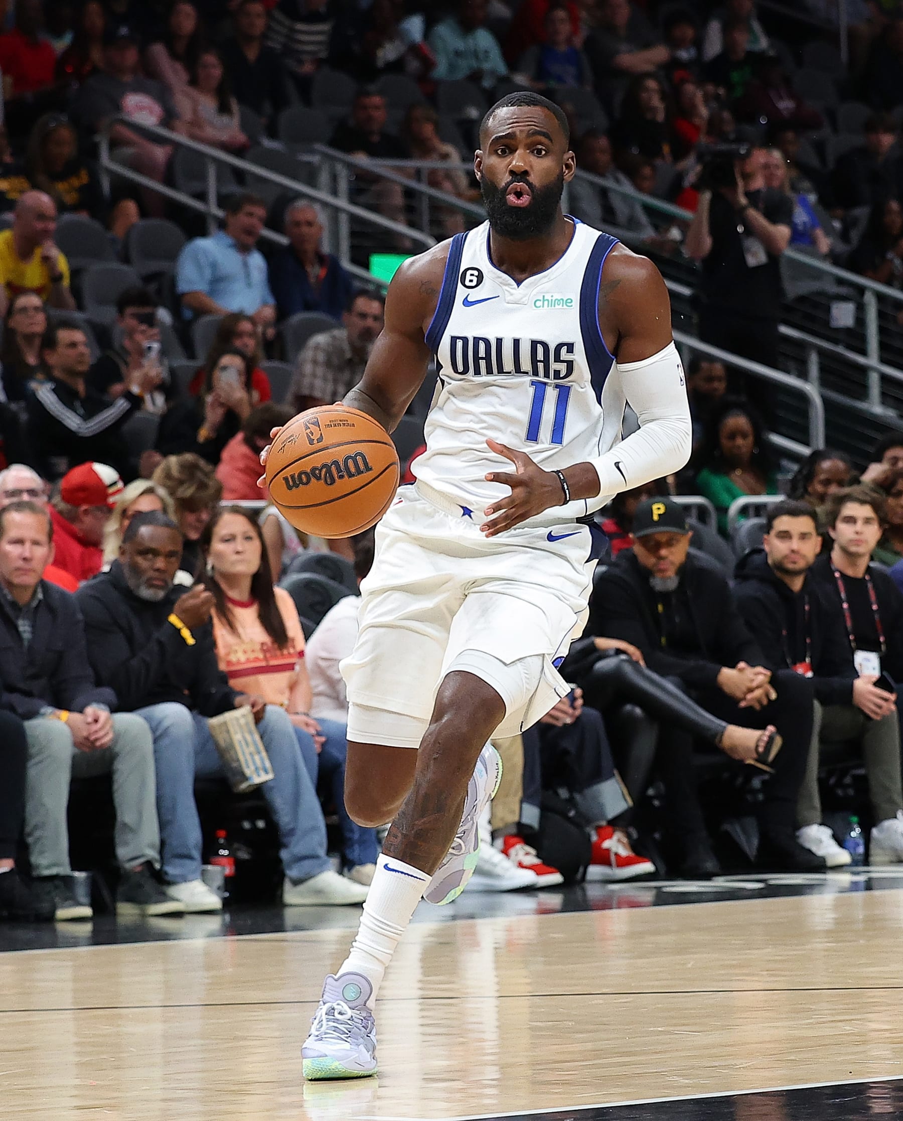 ATLANTA, GEORGIA - APRIL 02:  Tim Hardaway Jr. #11 of the Dallas Mavericks drives against the Atlanta Hawks during the first quarter at State Farm Arena on April 02, 2023 in Atlanta, Georgia.  NOTE TO USER: User expressly acknowledges and agrees that, by downloading and or using this photograph, User is consenting to the terms and conditions of the Getty Images License Agreement.  (Photo by Kevin C. Cox/Getty Images)