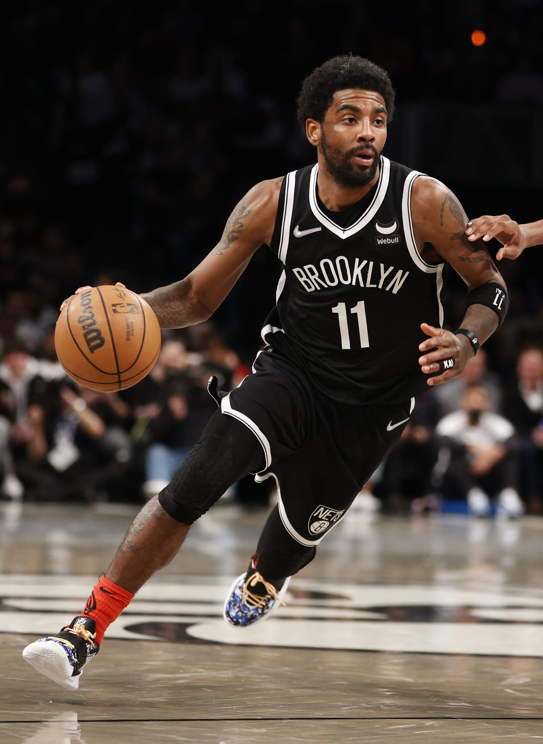 NEW YORK, NEW YORK - APRIL 12: Kyrie Irving #11 of the Brooklyn Nets dribbles during the first half of the Eastern Conference 2022 Play-In Tournament against the Cleveland Cavaliers at Barclays Center on April 12, 2022 in the Brooklyn borough of New York City. NOTE TO USER: User expressly acknowledges and agrees that, by downloading and or using this photograph, User is consenting to the terms and conditions of the Getty Images License Agreement. (Photo by Sarah Stier/Getty Images)