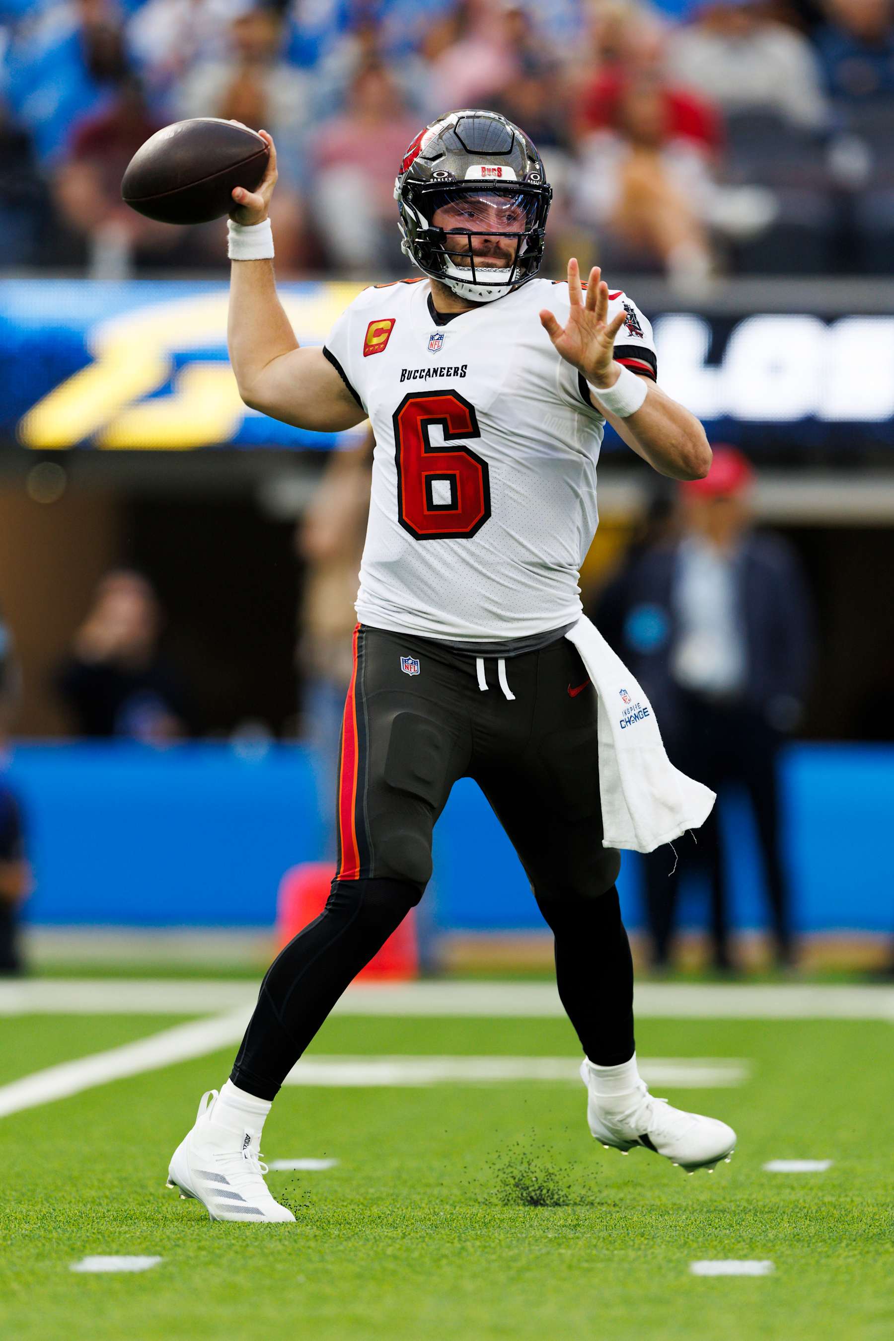 INGLEWOOD, CALIFORNIA - DECEMBER 15: Baker Mayfield #6 of the Tampa Bay Buccaneers throws on the run during the first half against the Los Angeles Chargers at SoFi Stadium on December 15, 2024 in Inglewood, California. (Photo by Ric Tapia/Getty Images)