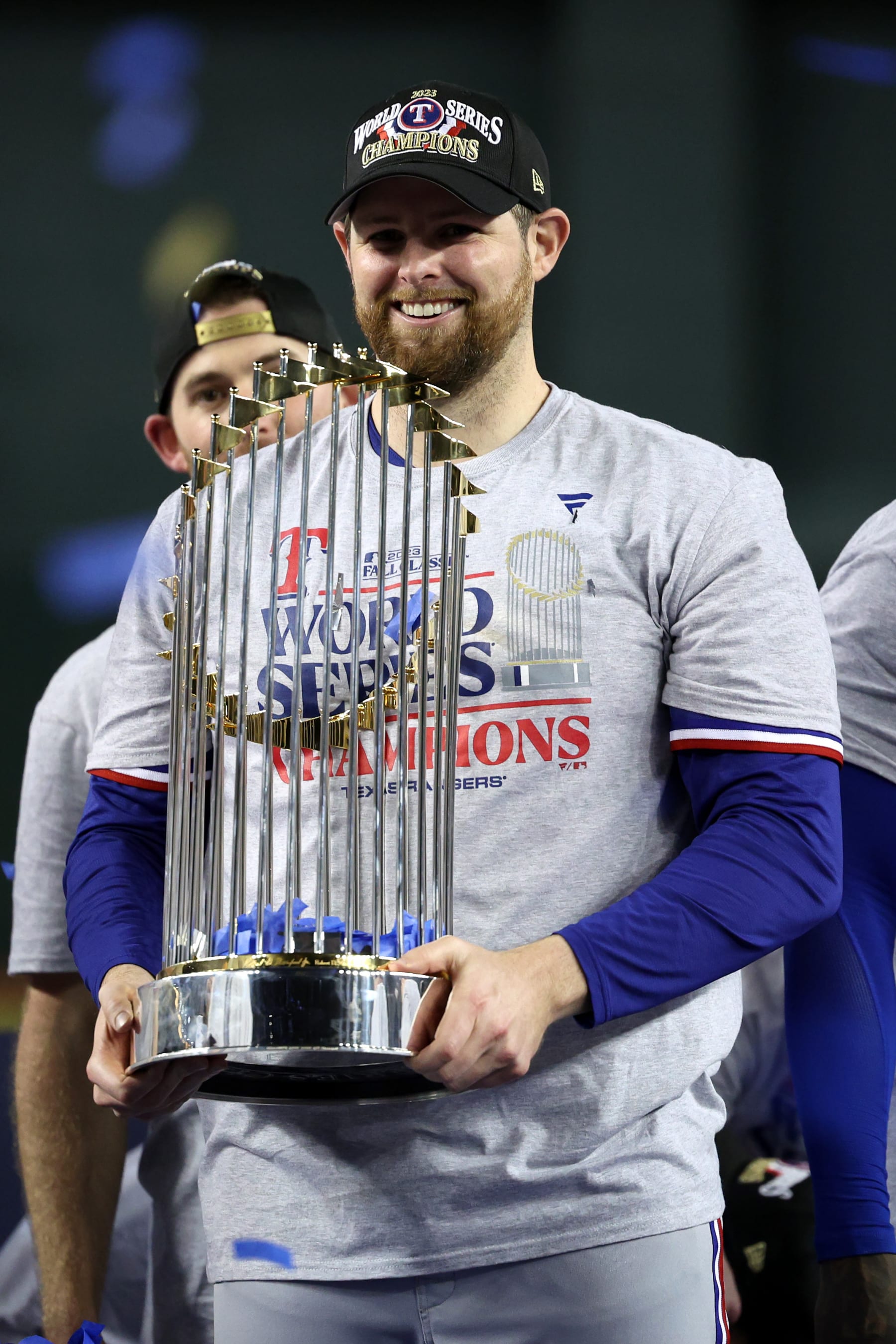 PHOENIX, ARIZONA - NOVEMBER 01: Jordan Montgomery #52 of the Texas Rangers celebrates with the Commissioner's Trophy after the Texas Rangers beat the Arizona Diamondbacks 5-0 in Game Five to win the World Series at Chase Field on November 01, 2023 in Phoenix, Arizona. (Photo by Harry How/Getty Images)