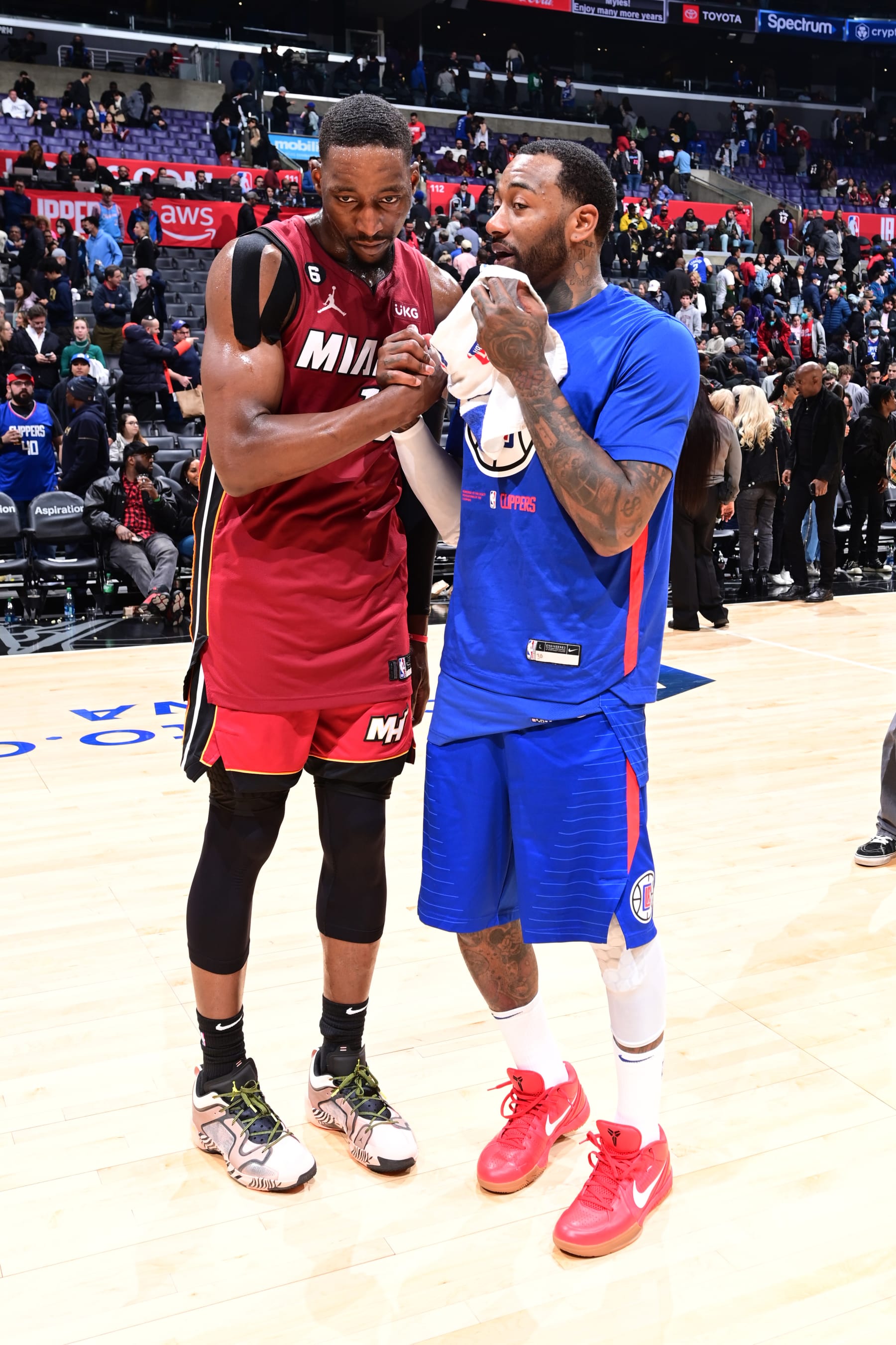 LOS ANGELES, CA - JANUARY 2: Bam Adebayo #13 of the Miami Heat talks with John Wall #11 of the LA Clippers after the game on January 2, 2023 at Crypto.Com Arena in Los Angeles, California. NOTE TO USER: User expressly acknowledges and agrees that, by downloading and/or using this Photograph, user is consenting to the terms and conditions of the Getty Images License Agreement. Mandatory Copyright Notice: Copyright 2023 NBAE (Photo by Adam Pantozzi/NBAE via Getty Images)