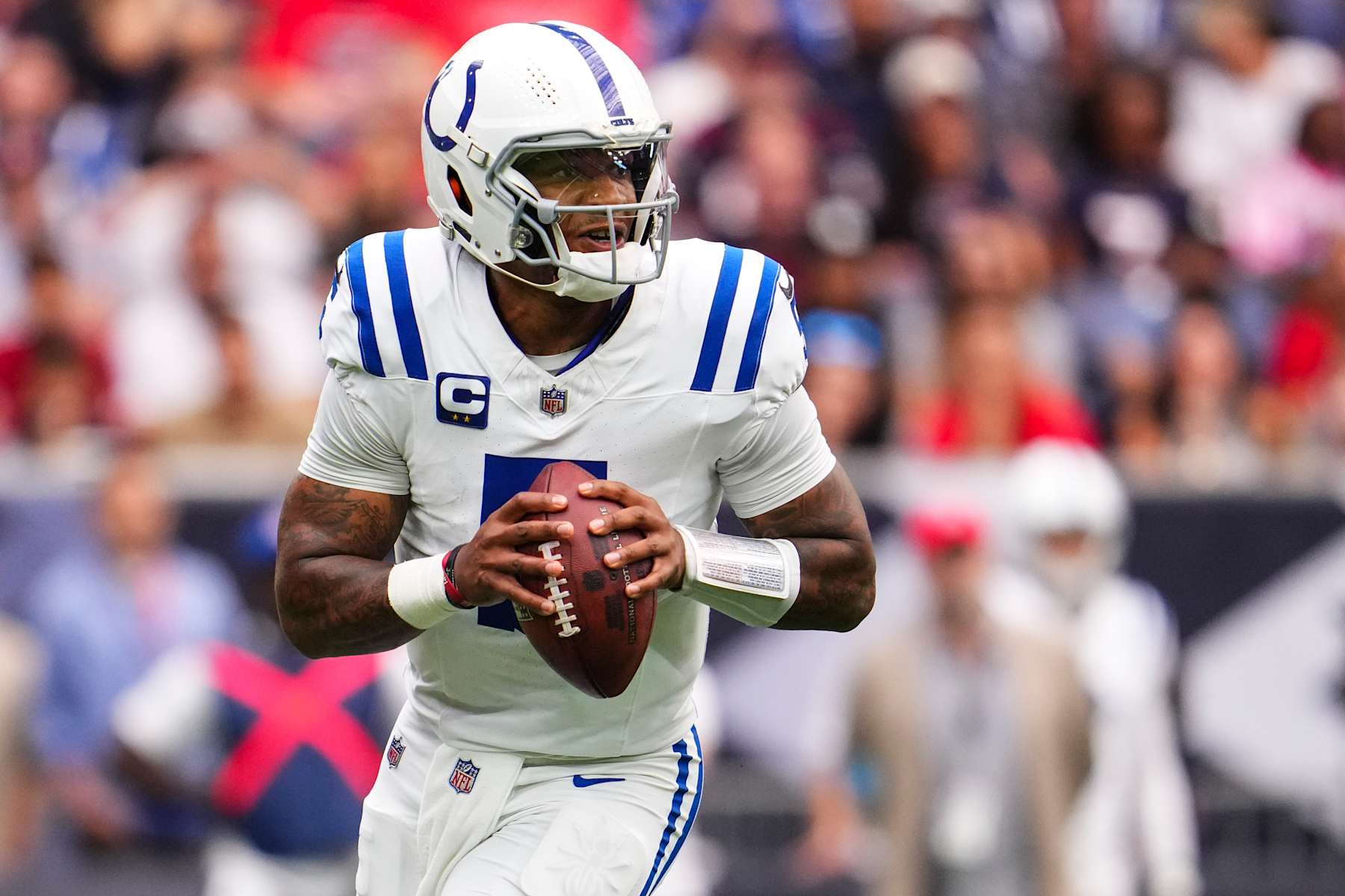 HOUSTON, TX - OCTOBER 27: Anthony Richardson #5 of the Indianapolis Colts scrambles out of the pocket during an NFL football game against the Houston Texans at NRG Stadium on October 27, 2024 in Houston, Texas. (Photo by Cooper Neill/Getty Images)