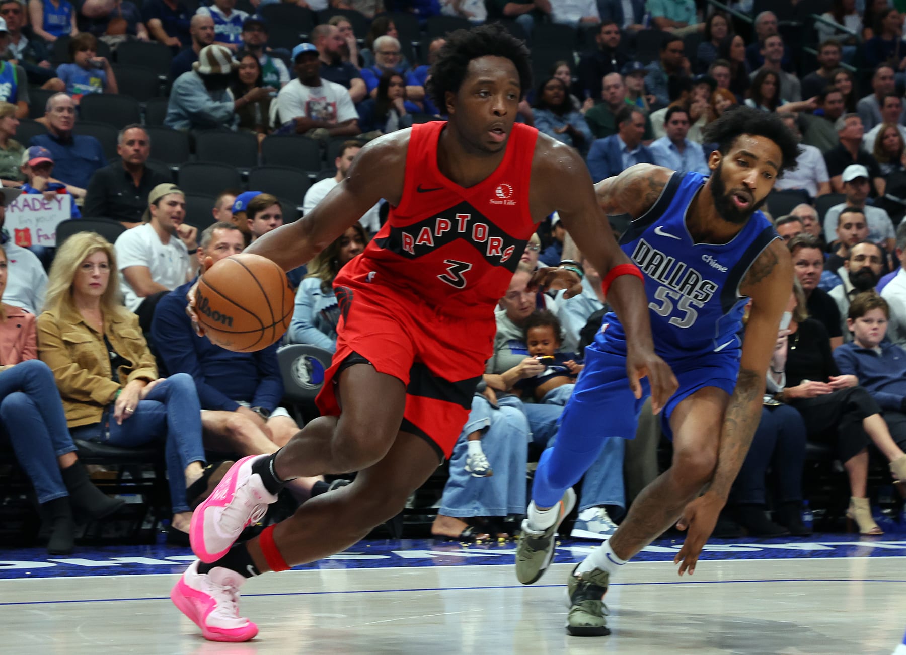 DALLAS, TEXAS - NOVEMBER 08: O.G. Anunoby #3 of the Toronto Raptors drives the ball past Derrick Jones Jr. #55 of the Dallas Mavericks in the fourth quarter at American Airlines Center on November 08, 2023 in Dallas, Texas. NOTE TO USER: User expressly acknowledges and agrees that, by downloading and or using this photograph, User is consenting to the terms and conditions of the Getty Images License Agreement.  (Photo by Richard Rodriguez/Getty Images)