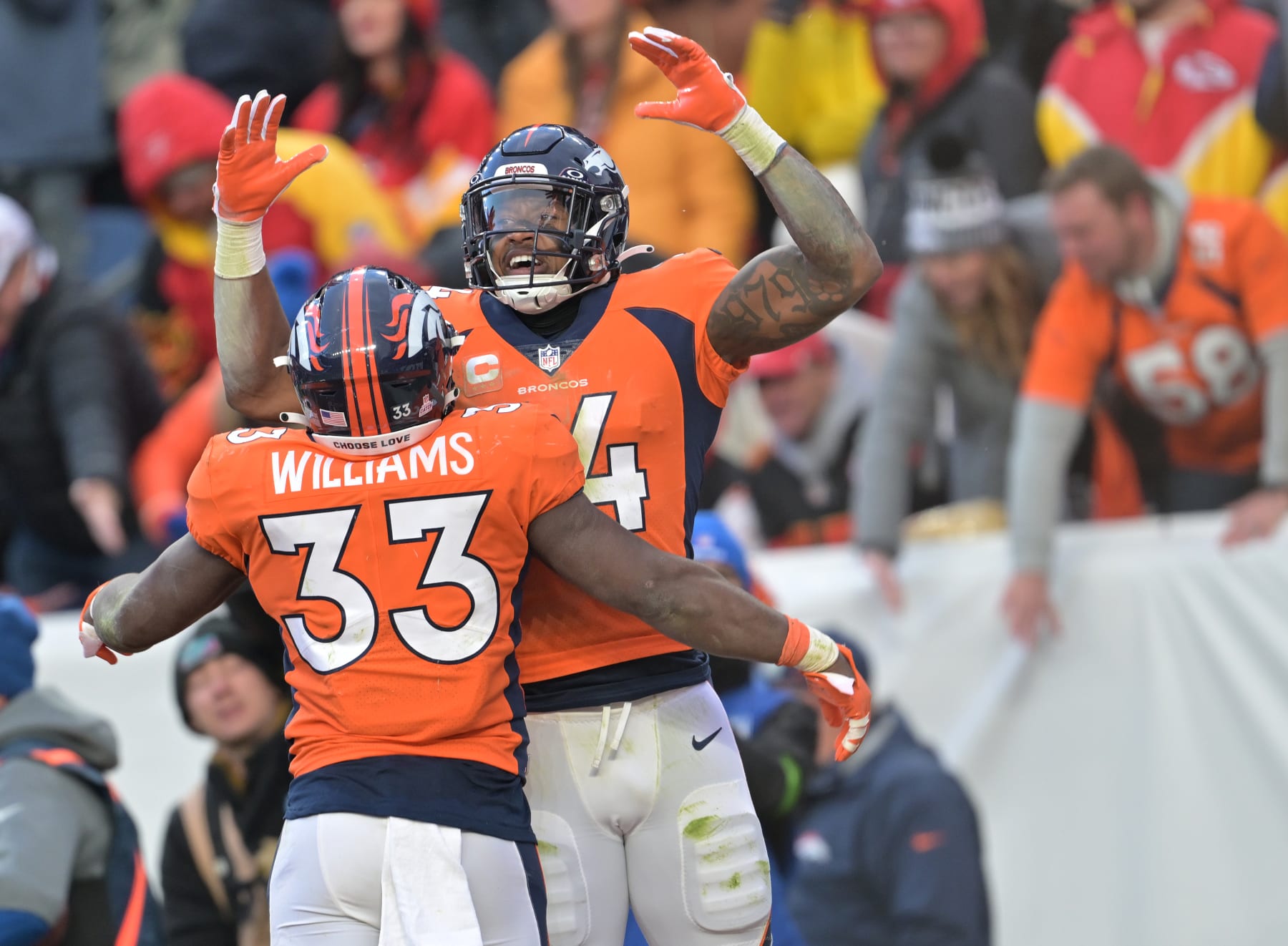 DENVER, COLORADO - OCTOBER 29: Denver Broncos running back Javonte Williams (33), left, celebrates a touchdown catch made by his teammate Denver Broncos wide receiver Courtland Sutton (14) during the second half at Empower Field at Mile High on October 29, 2023 in Denver, Colorado. The Denver Broncos beat the Kansas City Chiefs 24 to 9 during week 8 of the NFL regular season. (Photo by RJ Sangosti/MediaNews Group/The Denver Post via Getty Images)