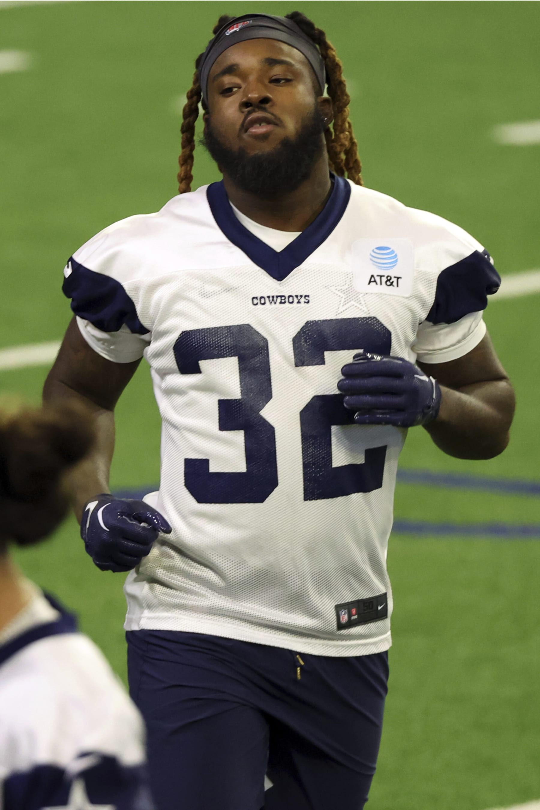 Dallas Cowboys running back Ronald Jones (32) runs off the field during mini camp on Tuesday, June 6, 2023, in Frisco, Texas. (AP Photo/Richard W. Rodriguez)