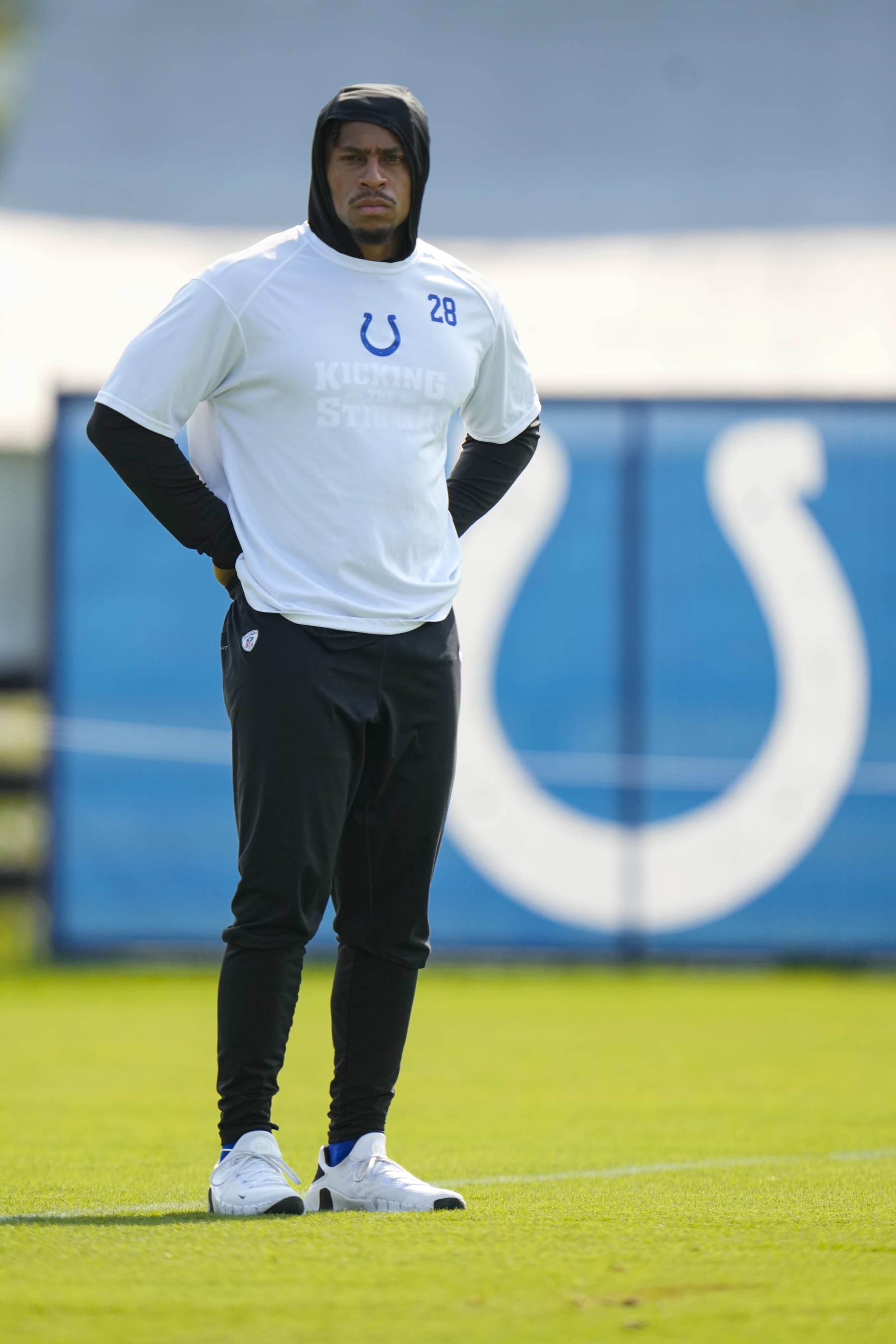 Indianapolis Colts running back Jonathan Taylor watches from he sideline during practice at the NFL team's football training camp in Westfield, Ind., Tuesday, Aug. 1, 2023. (AP Photo/Michael Conroy)