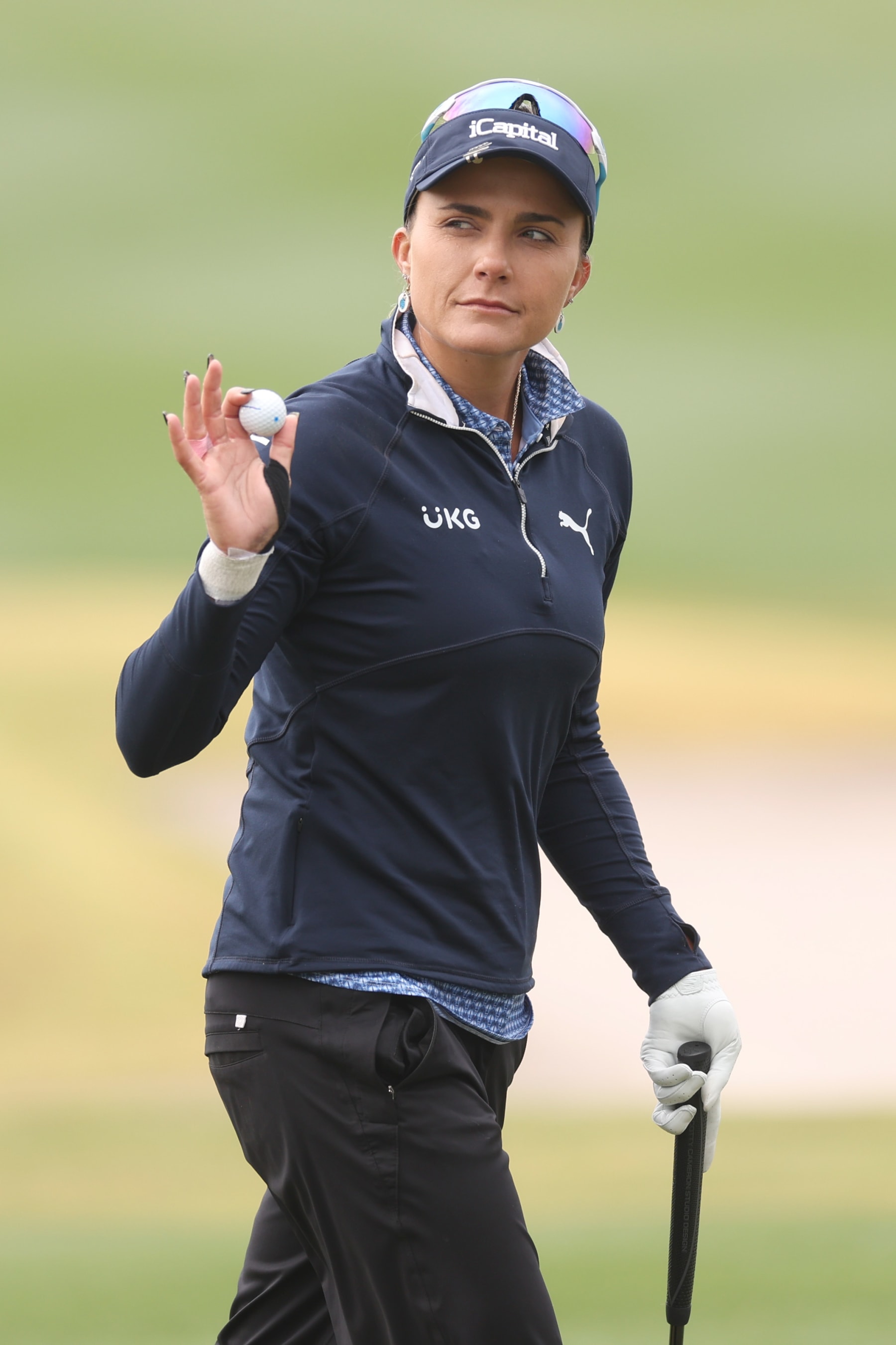 PHOENIX, ARIZONA - MARCH 31: Lexi Thompson of the United States reacts on the 18th green during the final round of the Ford Championship presented by KCC at Seville Golf and Country Club on March 31, 2024 in Phoenix, Arizona. (Photo by Christian Petersen/Getty Images)