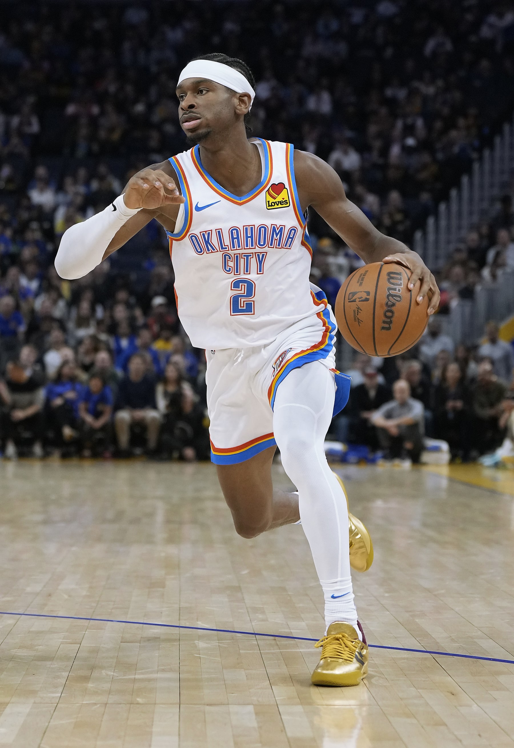 SAN FRANCISCO, CALIFORNIA - NOVEMBER 16: Shai Gilgeous-Alexander #2 of the Oklahoma City Thunder dribbles the ball against the Golden State Warriors during the second quarter of an NBA basketball game at Chase Center on November 16, 2023 in San Francisco, California. NOTE TO USER: User expressly acknowledges and agrees that, by downloading and or using this photograph, User is consenting to the terms and conditions of the Getty Images License Agreement. (Photo by Thearon W. Henderson/Getty Images)
