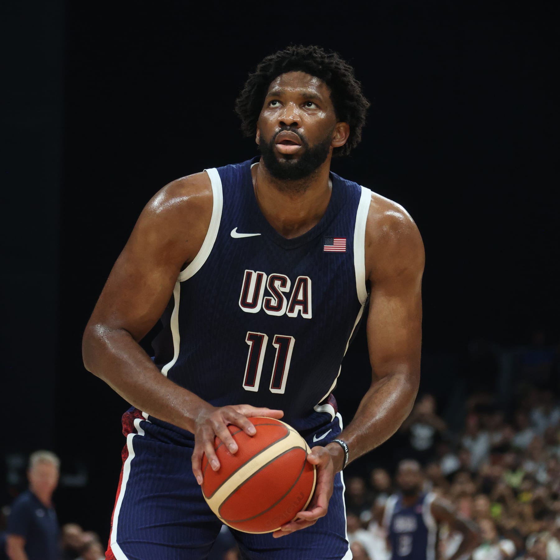 ABU DHABI, UAE - JULY 15: Joel Embiid #11 of the USA Basketball Men's Team shoots a free throw during the game against the Australian Basketball Men's Team during the 2024 USA Basketball Showcase on July 15, 2024 in Abu Dhabi, The United Arab Emirates at Etihad Arena. NOTE TO USER: User expressly acknowledges and agrees that, by downloading and/or using this Photograph, user is consenting to the terms and conditions of the Getty Images License Agreement. Mandatory Copyright Notice: Copyright 2024 NBAE (Photo by Nathaniel S. Butler/NBAE via Getty Images)