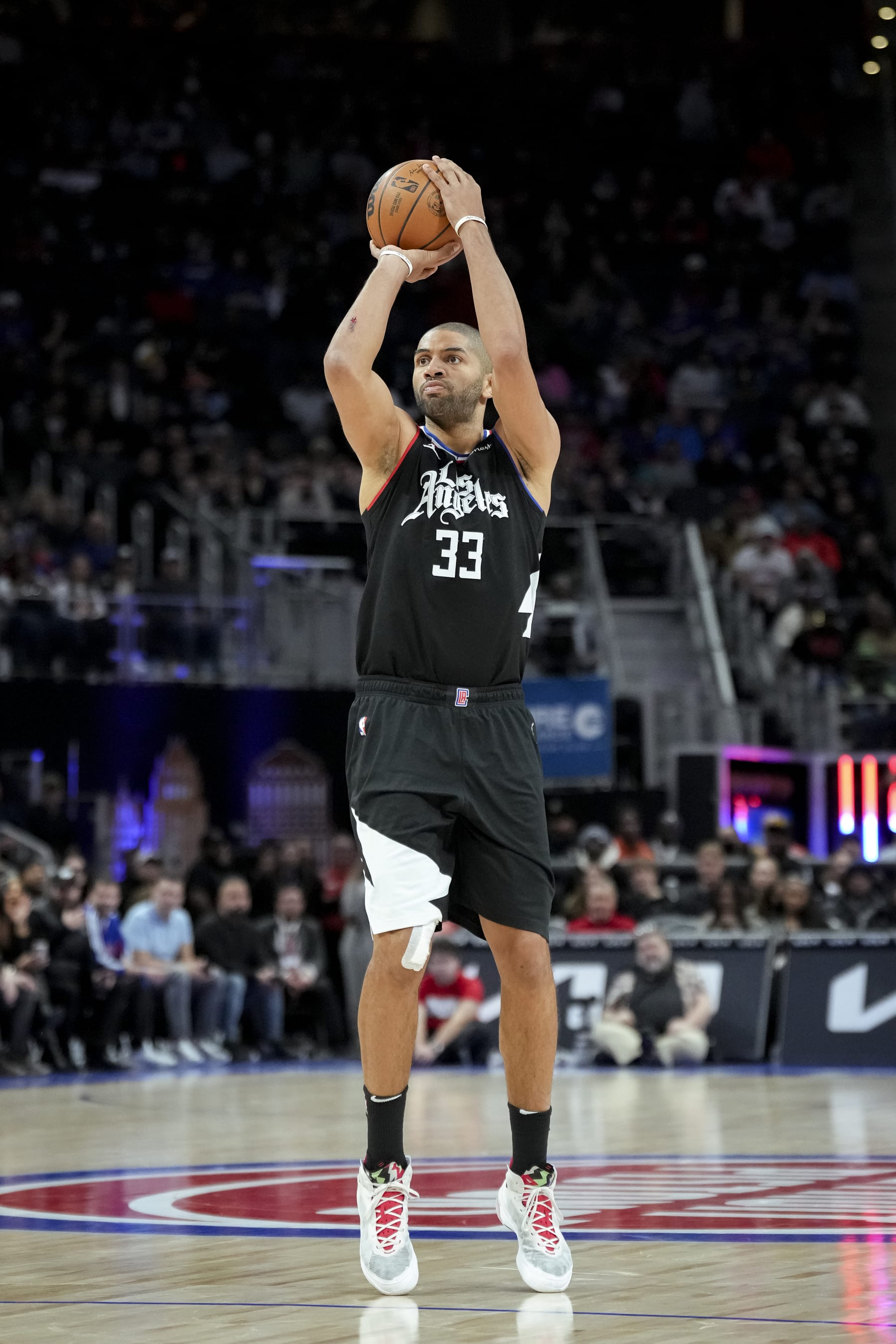DETROIT, MICHIGAN - DECEMBER 26: Nicolas Batum #33 of the LA Clippers shoots the ball against the Detroit Pistons at Little Caesars Arena on December 26, 2022 in Detroit, Michigan. NOTE TO USER: User expressly acknowledges and agrees that, by downloading and or using this photograph, User is consenting to the terms and conditions of the Getty Images License Agreement. (Photo by Nic Antaya/Getty Images)