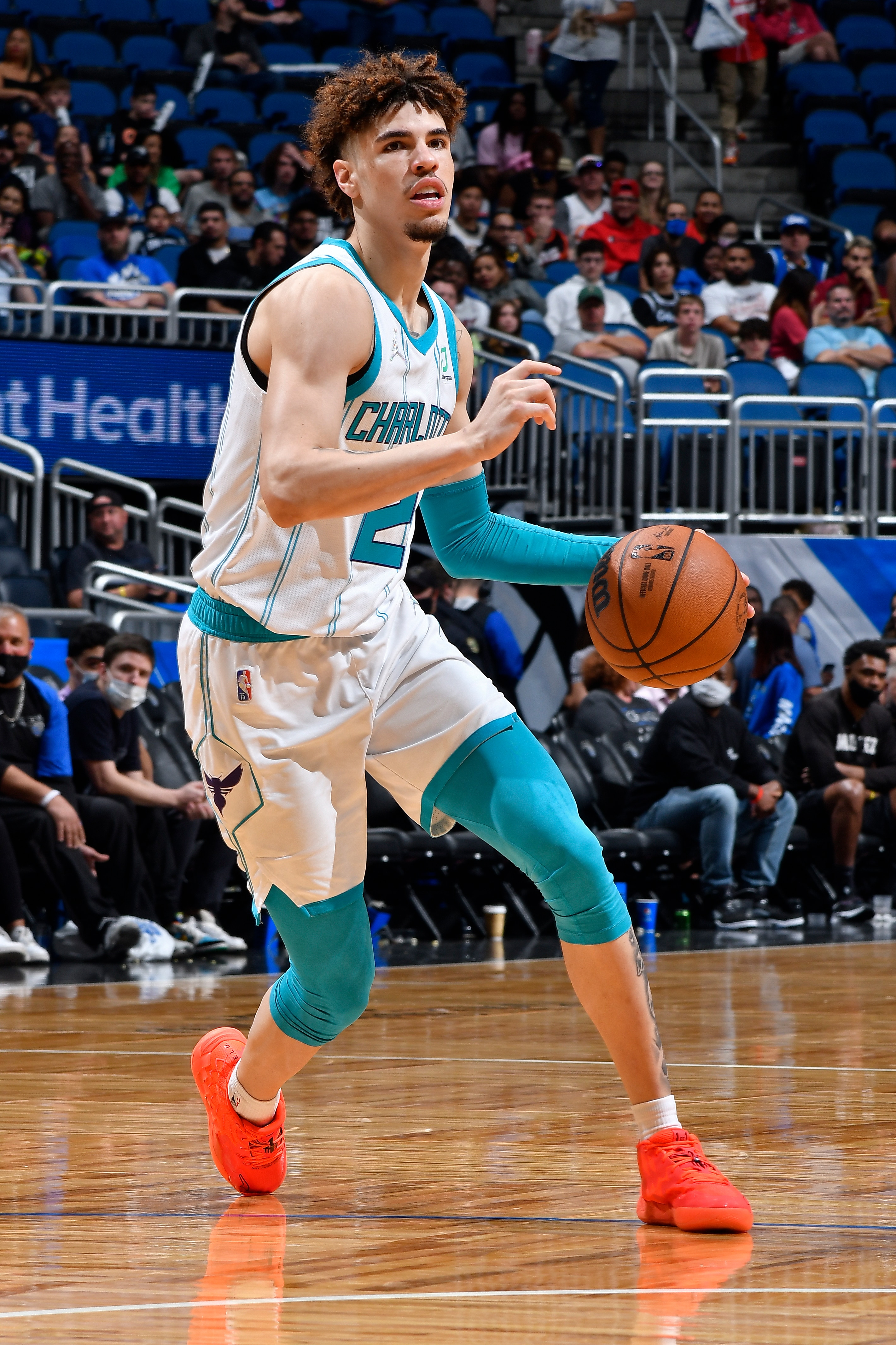 ORLANDO, FL - OCTOBER 27: LaMelo Ball #2 of the Charlotte Hornets dribbles the ball against the Orlando Magic on October 27, 2021 at Amway Center in Orlando, Florida. NOTE TO USER: User expressly acknowledges and agrees that, by downloading and or using this photograph, User is consenting to the terms and conditions of the Getty Images License Agreement. Mandatory Copyright Notice: Copyright 2021 NBAE (Photo by Fernando Medina/NBAE via Getty Images)