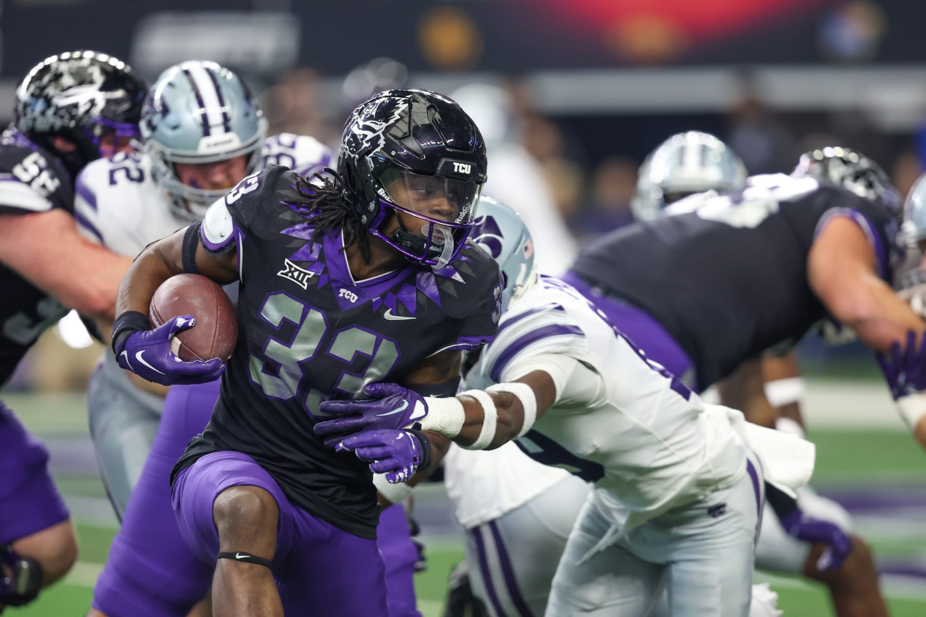 ARLINGTON, TX - DECEMBER 03: TCU Horned Frogs running back Kendre Miller (33) carries the ball during the Big 12 Championship game between TCU and Kansas State on December 3, 2022 at AT&T Stadium in Arlington, TX. (Photo by George Walker/Icon Sportswire via Getty Images)