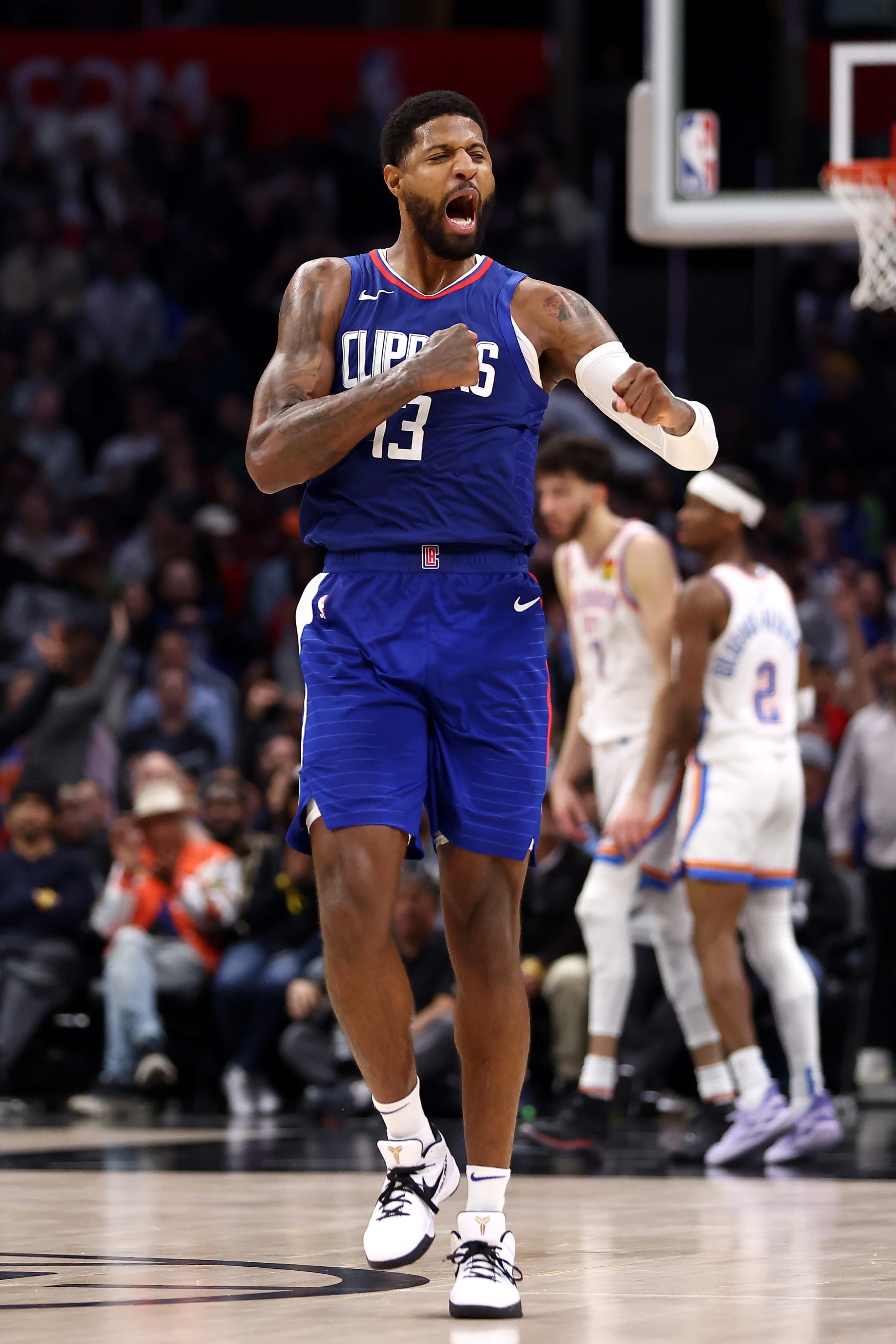 LOS ANGELES, CALIFORNIA - JANUARY 16: Paul George #13 of the Los Angeles Clippers celebrates after a three-point basket during the fourth quarter against the Oklahoma City Thunder at Crypto.com Arena on January 16, 2024 in Los Angeles, California. NOTE TO USER: User expressly acknowledges and agrees that, by downloading and or using this photograph, User is consenting to the terms and conditions of the Getty Images License Agreement. (Photo by Katelyn Mulcahy/Getty Images)
