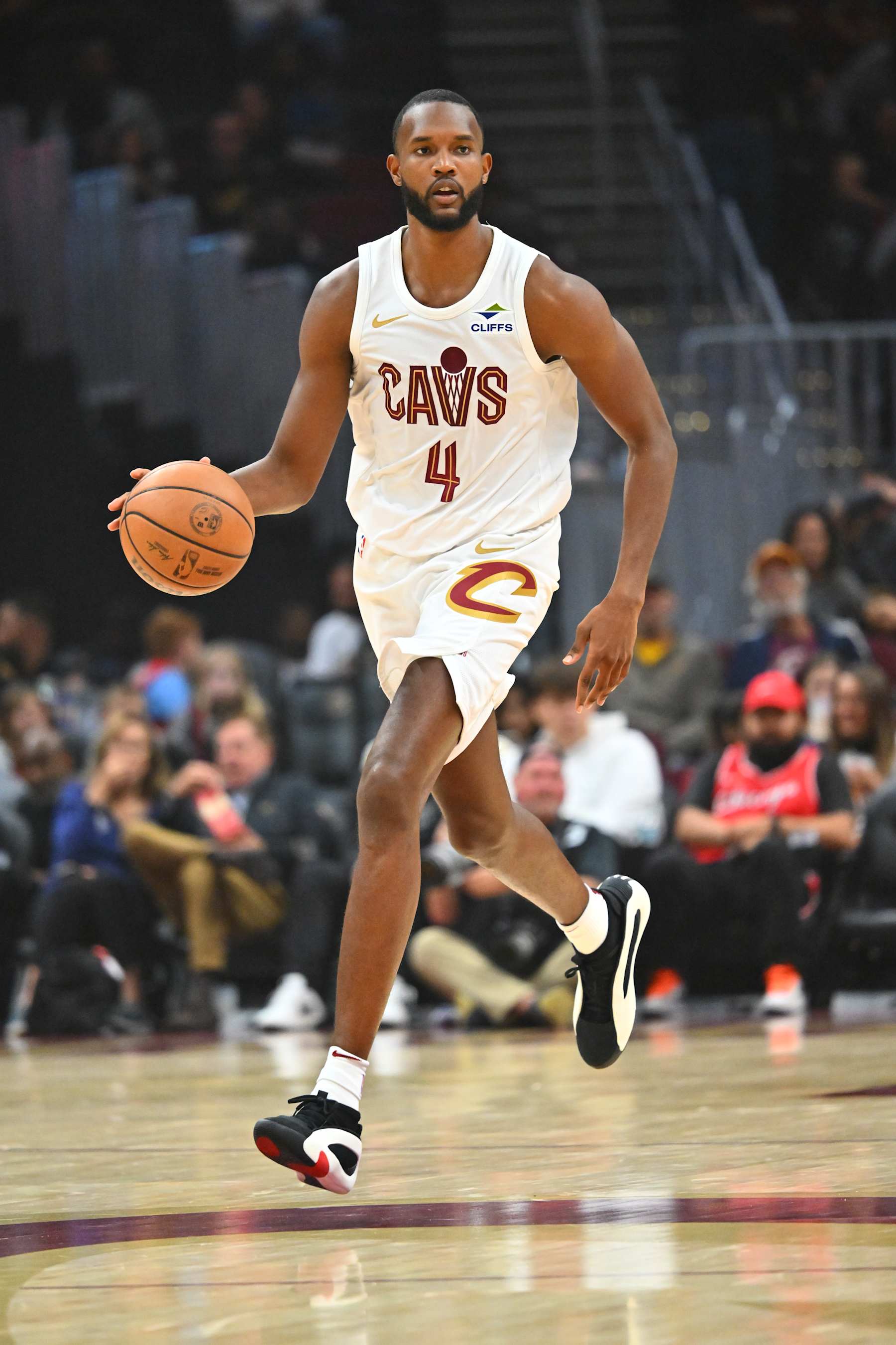 CLEVELAND, OHIO - OCTOBER 08: Evan Mobley #4 of the Cleveland Cavaliers brings the ball up court during the first half of a preseason game against the Chicago Bulls at Rocket Mortgage Fieldhouse on October 08, 2024 in Cleveland, Ohio. NOTE TO USER: User expressly acknowledges and agrees that, by downloading and or using this photograph, User is consenting to the terms and conditions of the Getty Images License Agreement. (Photo by Jason Miller/Getty Images)